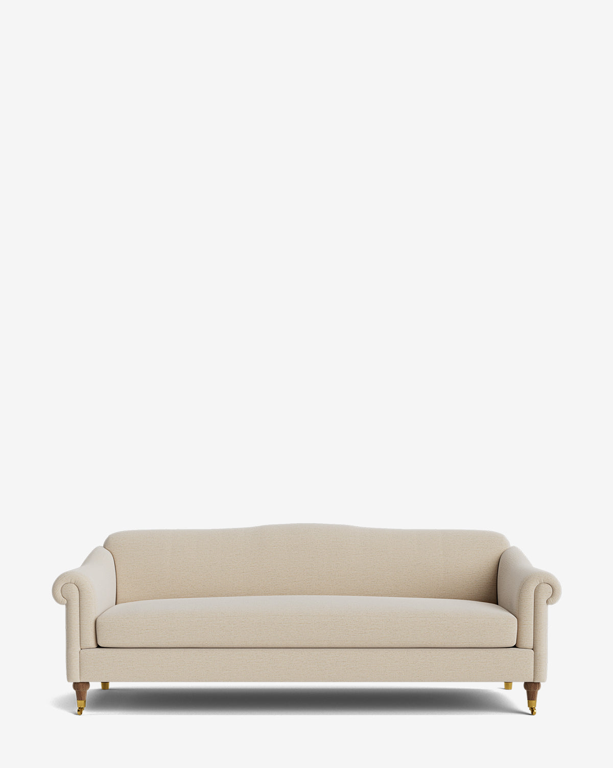 The Hildegard Sofa 90 is a cream-colored, handcrafted sofa with rolled arms, a curved backrest, and wooden legs with brass casters, shown against a plain white background by McGee & Co.
