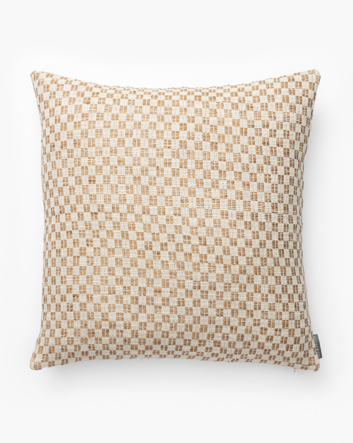 The Holscher Checkered Pillow Cover, shown on a white background, features a light beige and tan woven checkered pattern in cotton and linen with a small fabric tag for added detail, by McGee & Co.