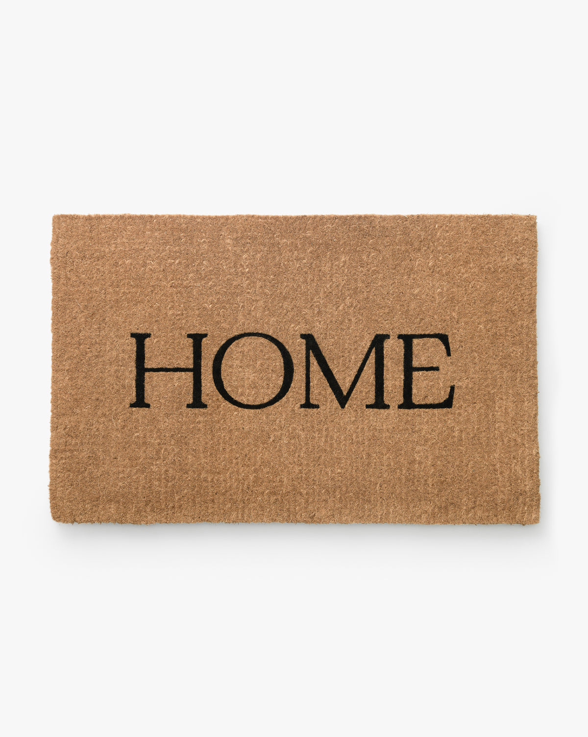 The Palm Fiber Home Doormat is a rectangular, handwoven coir mat in brown with HOME in bold black letters at the center, shown on a white background. McGee & Co.