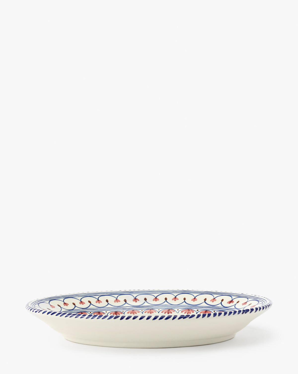 The Honor Serving Platter is a shallow ceramic platter featuring a blue and red wavy rim pattern from Sharland England, shown on a plain white background, by McGee & Co.