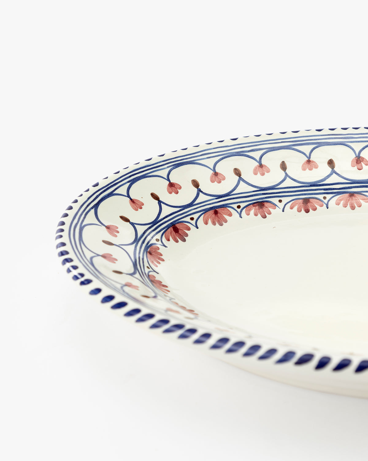 A close-up of the Honor Serving Platter, featuring a blue and red floral rim pattern on ceramic, set against a white background. This elegant Sharland England piece brings charm to any table setting, by McGee & Co.
