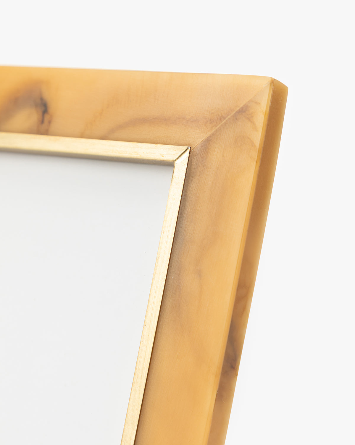 A close-up of the Horn Design Frame, featuring a light brown finish and thin gold inner border, highlights its sophisticated style against a plain white background—ideal for enhancing your home decor.