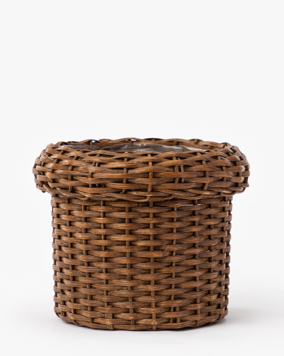 The Huger Woven Planter is a round, brown wicker planter with a wide, slightly flared rim and intricate woven details, shown against a plain white background, by McGee & Co.