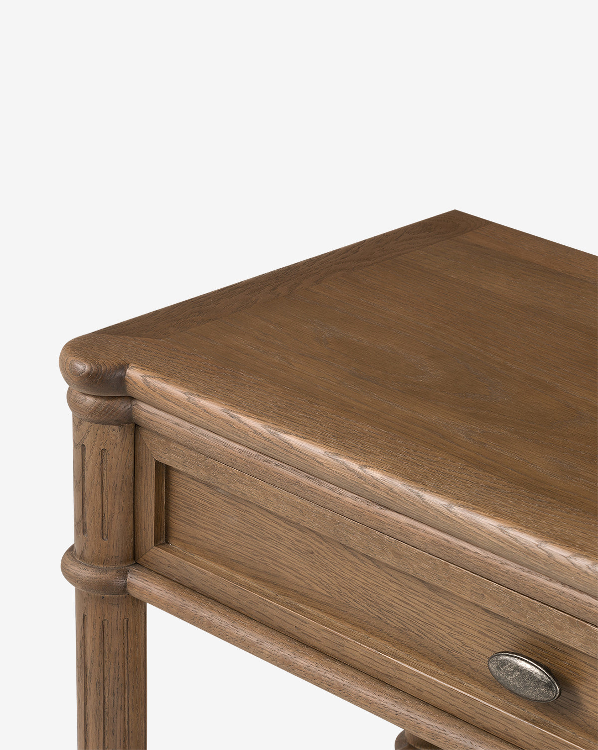 A close-up of the Humphrey Nightstand highlights its classic oak build, natural finish, visible grain, rounded edges, and single drawer with a metal handle—showcasing timeless bedroom style by McGee & Co.