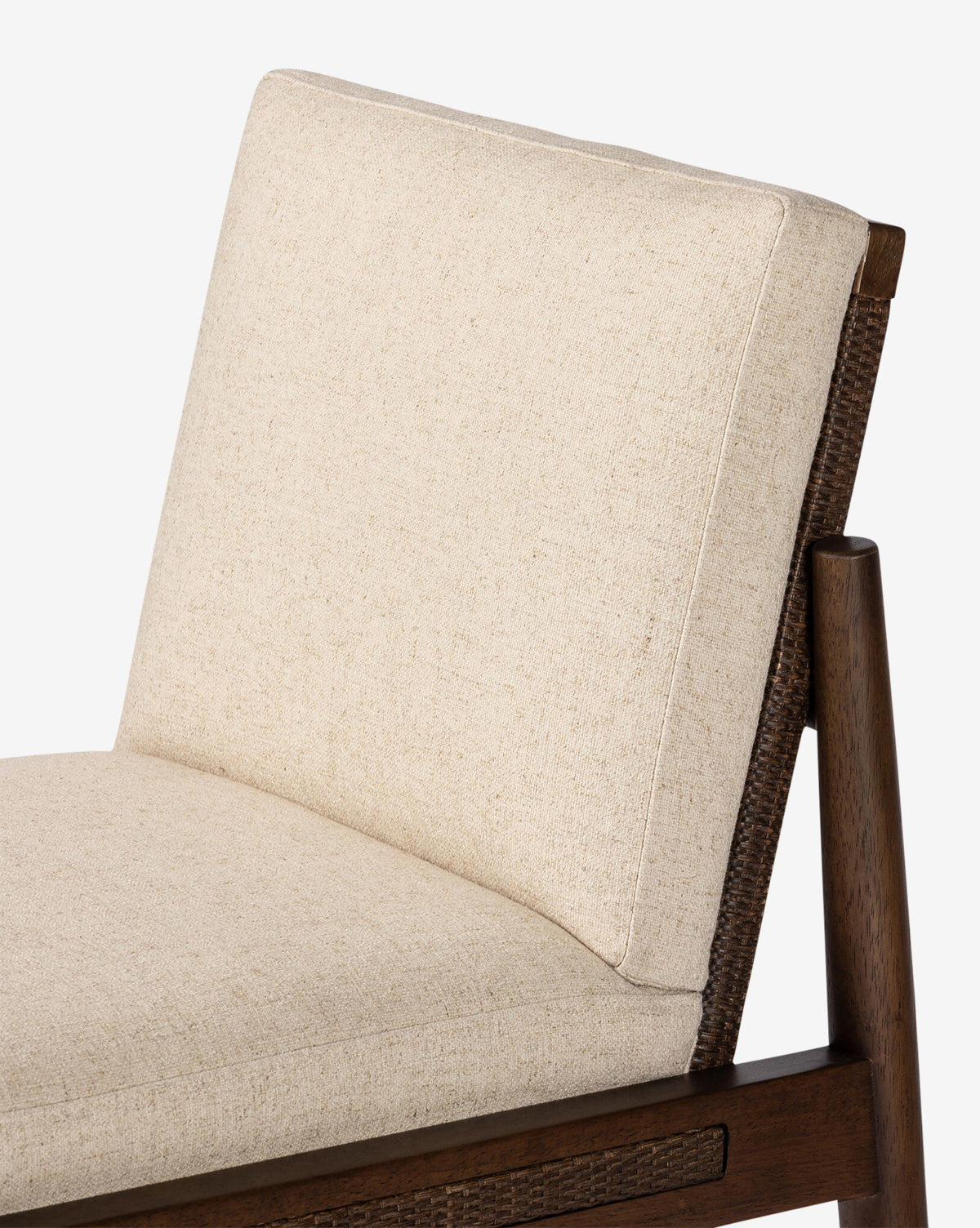Close-up of the Hurley Dining Chair, showcasing its cushioned seat and backrest in light beige performance upholstery on a medium brown wooden frame with a simple, contemporary design, by McGee & Co.