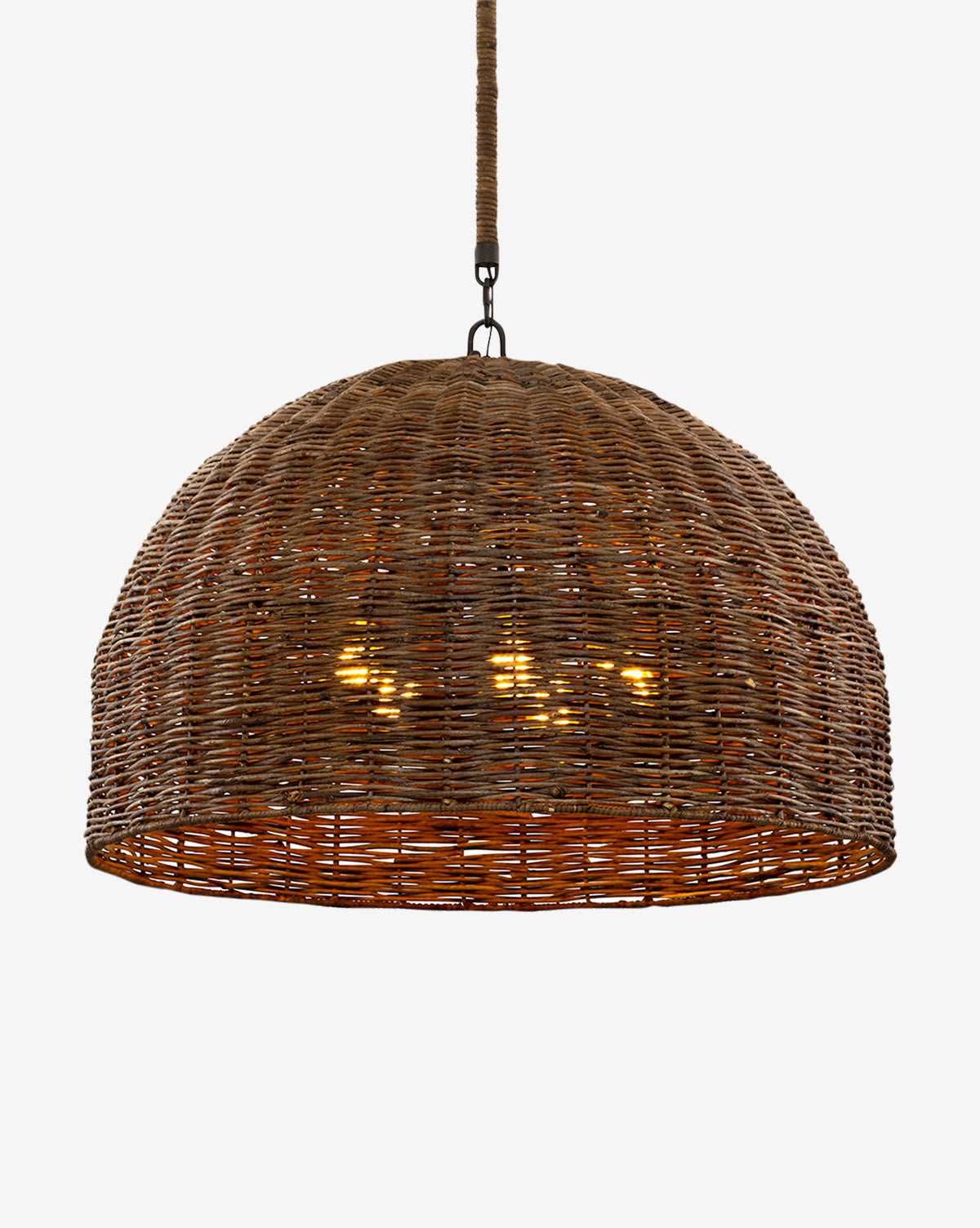 The Huxley Chandelier by Troy Lighting features a dome-shaped, woven rattan design that hangs from the ceiling, casting a warm glow through its natural brown wicker material. McGee & Co.