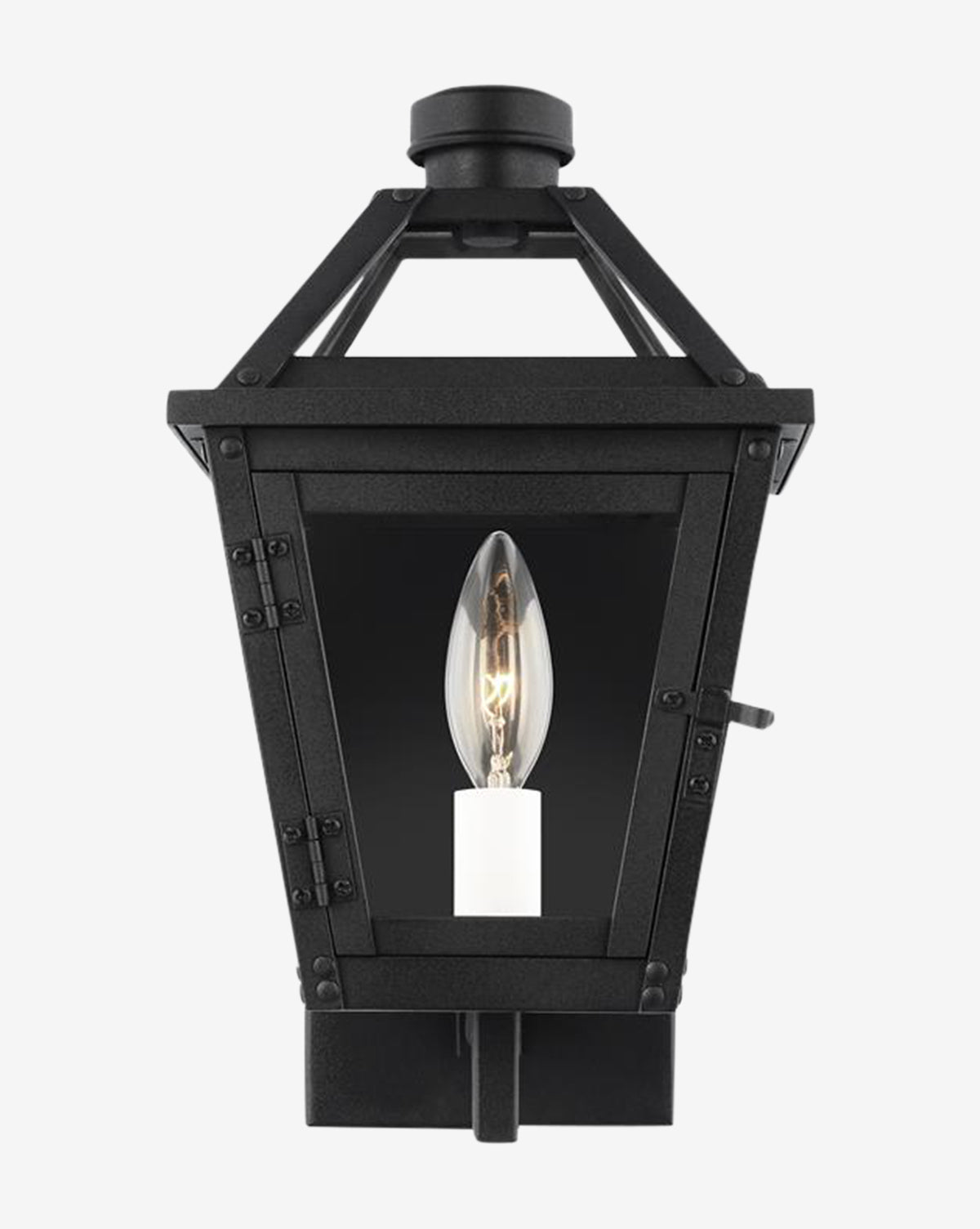 The Hyannis Outdoor Wall Lantern is a black fixture with a classic lantern shape, rust-proof construction, clear glass panels, and a single candle-style bulb inside, by McGee & Co.