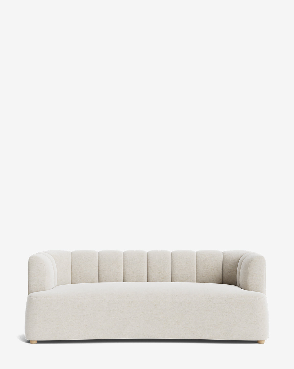 The Ines Sofa 90 is a modern piece in light beige upholstery, featuring a low, curved back with vertical channel tufting and short rounded wooden legs, by McGee & Co.
