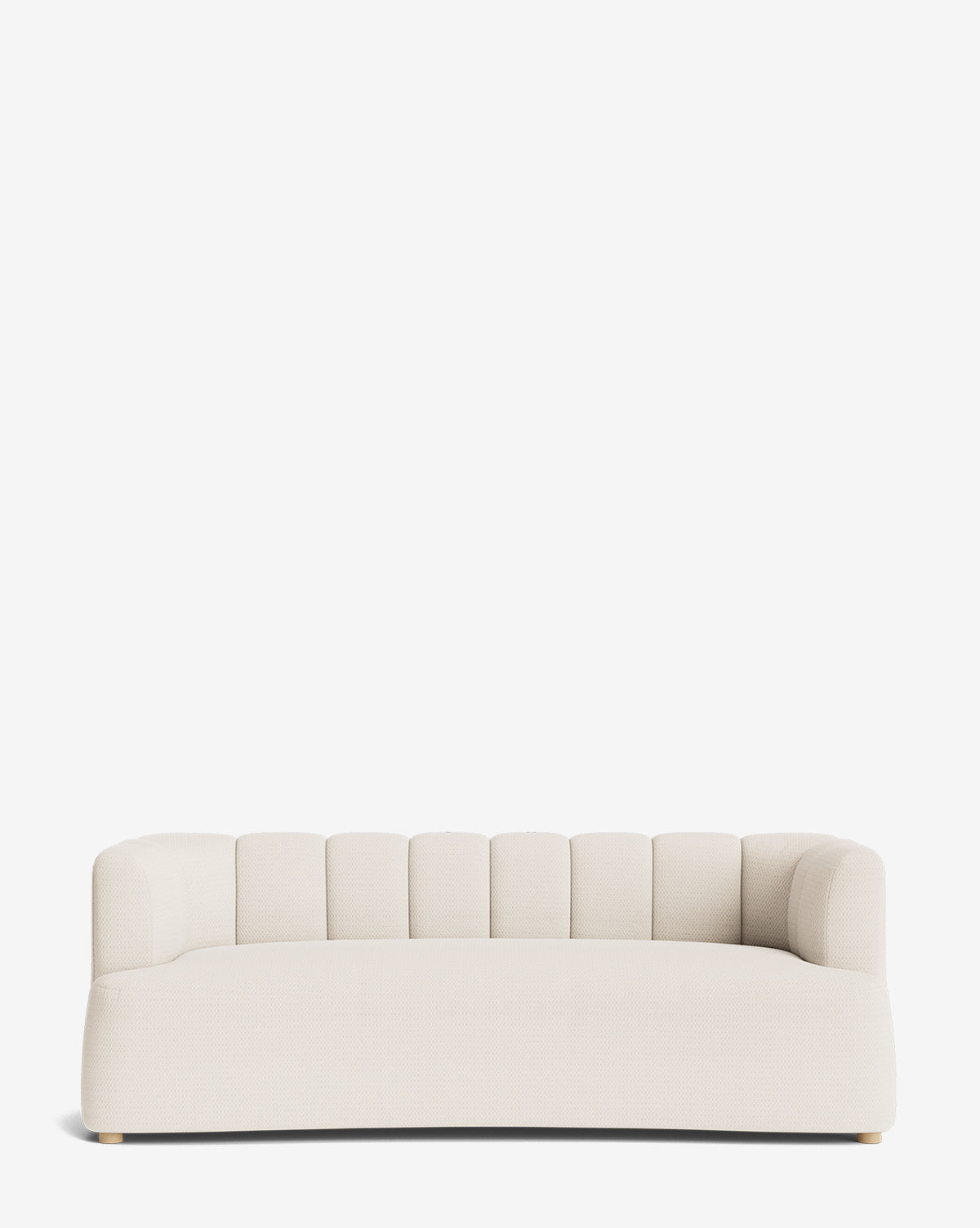The Ines Sofa 90 is a modern, low-profile cream velvet sofa featuring a rounded backrest and subtle vertical tufting, shown against a plain white background by McGee & Co.