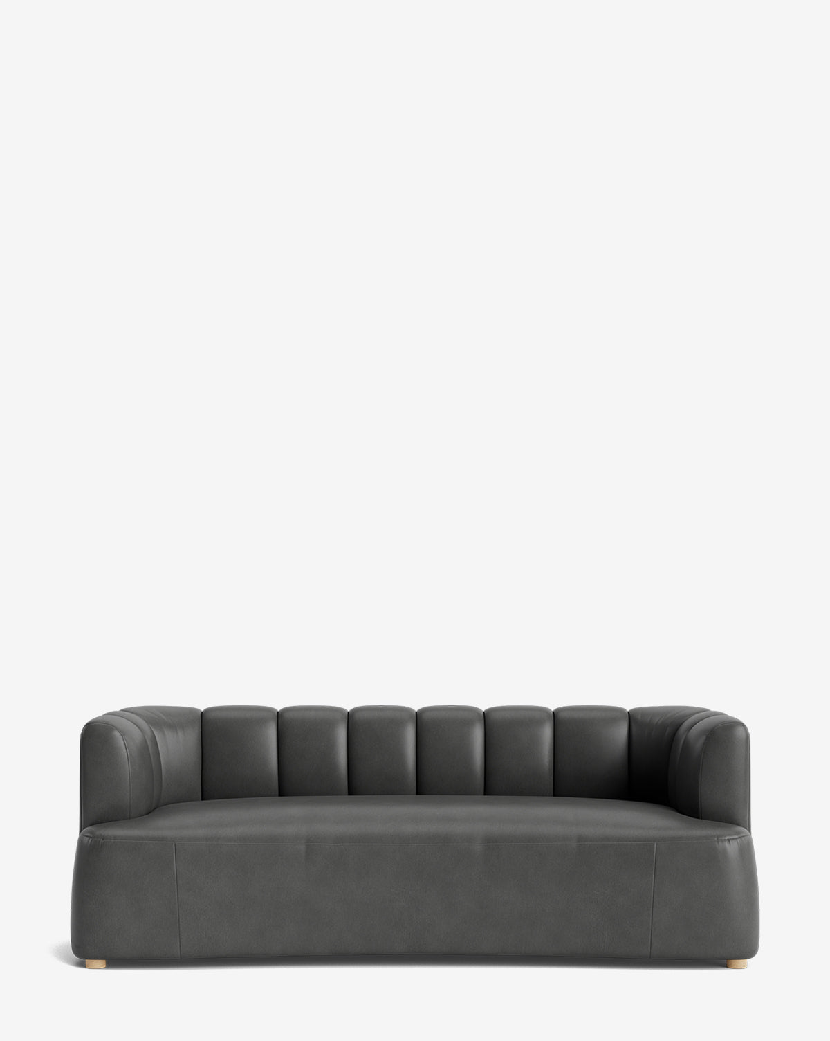 The Ines Sofa 90 is a modern dark gray velvet sofa with a low back, vertical tufting, rounded armrests, and wooden legs—perfect for adding chic elegance to any space, by McGee & Co.