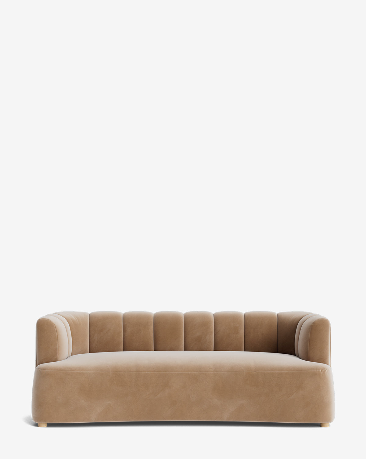 The Ines Sofa 90 is a modern tan velvet sofa with a curved backrest and vertical channel tufting, set on short wooden feet against a plain white background, by McGee & Co.