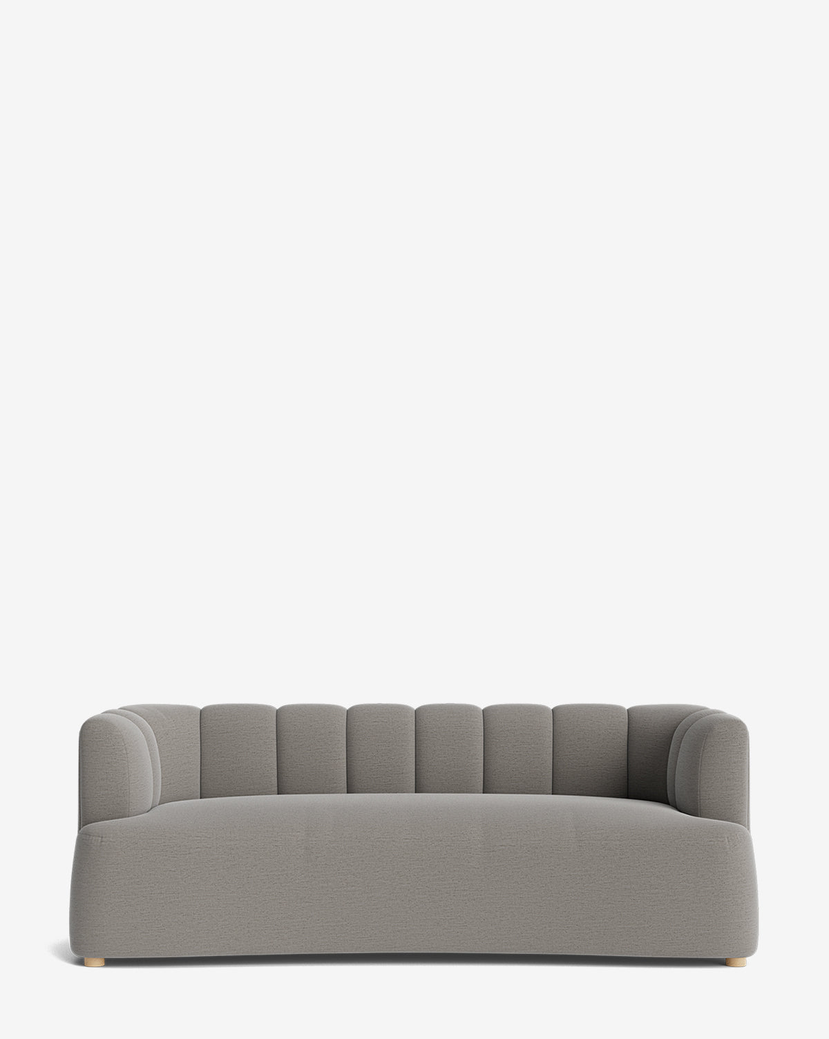 The Ines Sofa 90 is a modern light gray velvet sofa with a low backrest, rounded arms, vertical channel tufting on the back, and small light wood feet, shown against a plain white background by McGee & Co.
