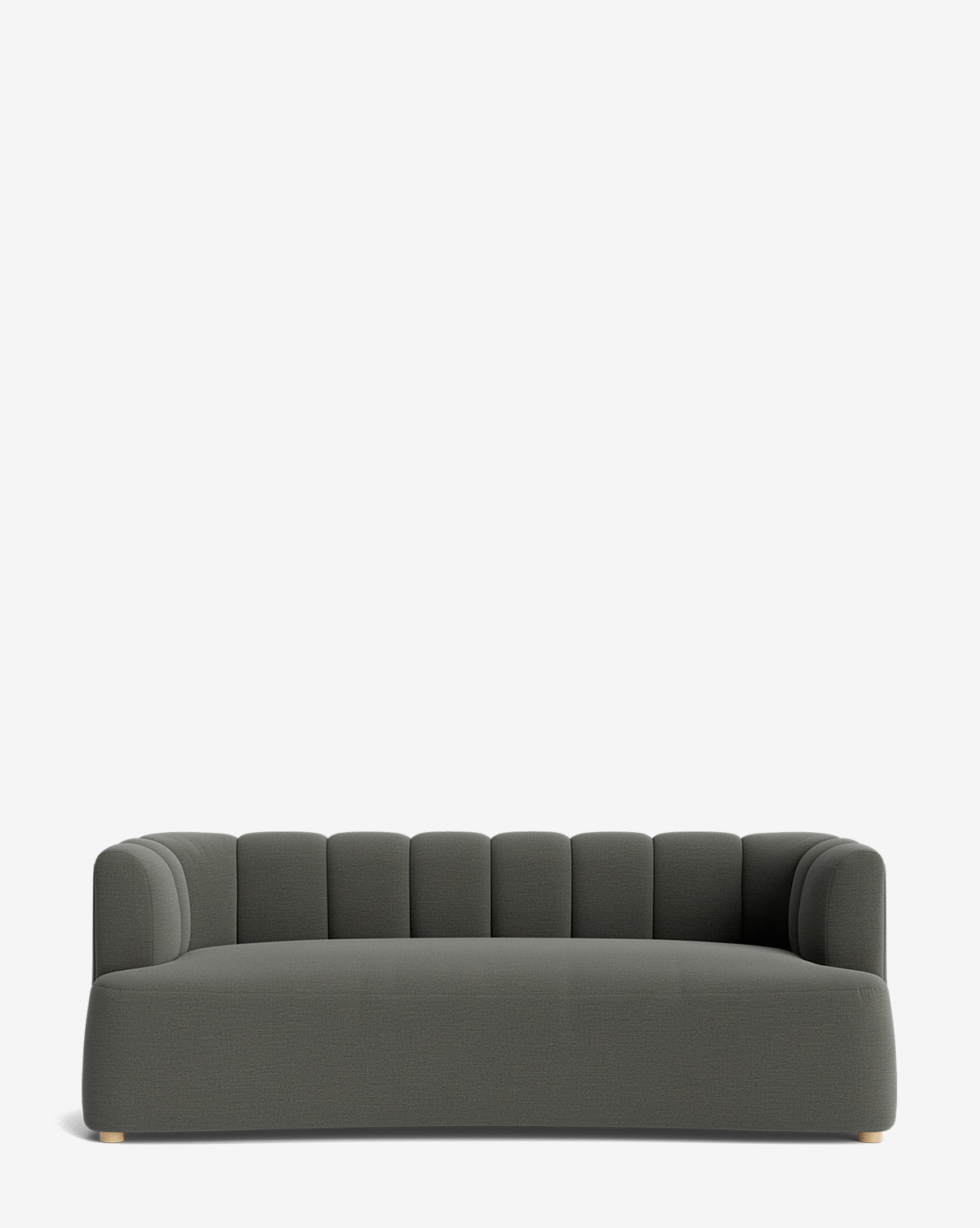 The Ines Sofa 90 is a modern, dark gray velvet sofa with a low backrest and rounded, channel-tufted design. It features a wide seat, small light-colored feet, and is displayed against a plain white background by McGee & Co.