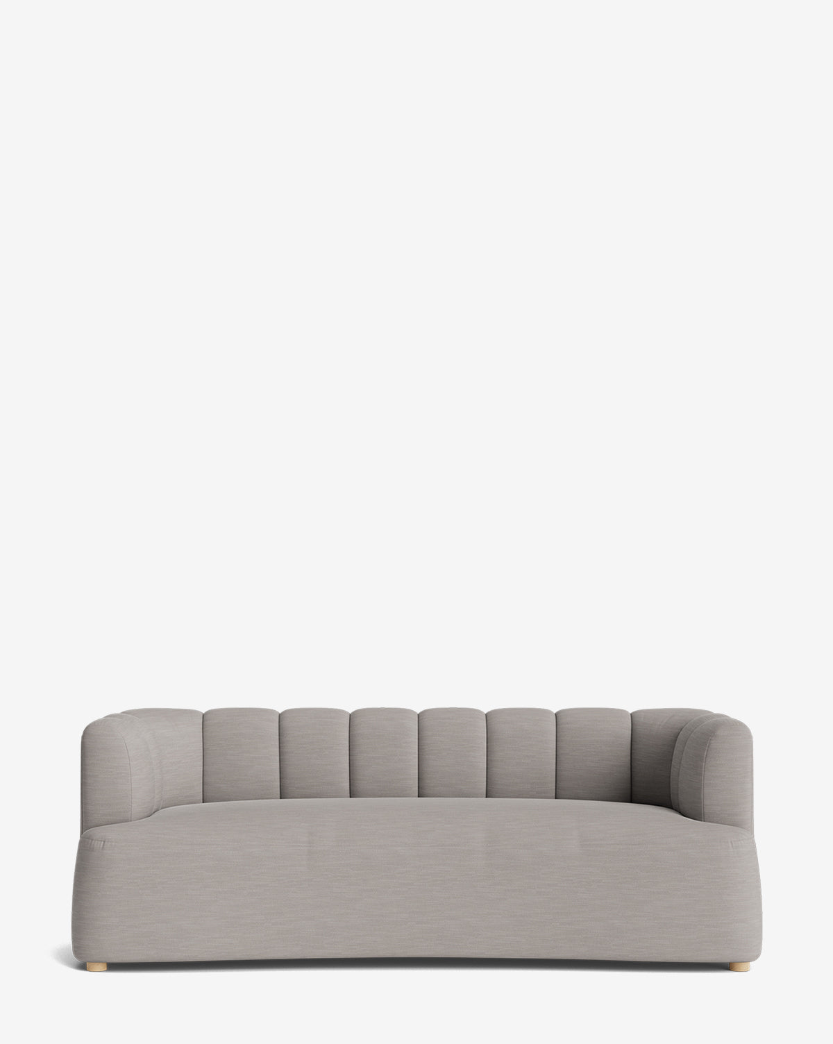 The Ines Sofa 90 showcases a modern design with light gray velvet upholstery, a low backrest, rounded arms, and vertical channel tufting on its back and sides. Small light wooden feet add elegance against a plain white background by McGee & Co.
