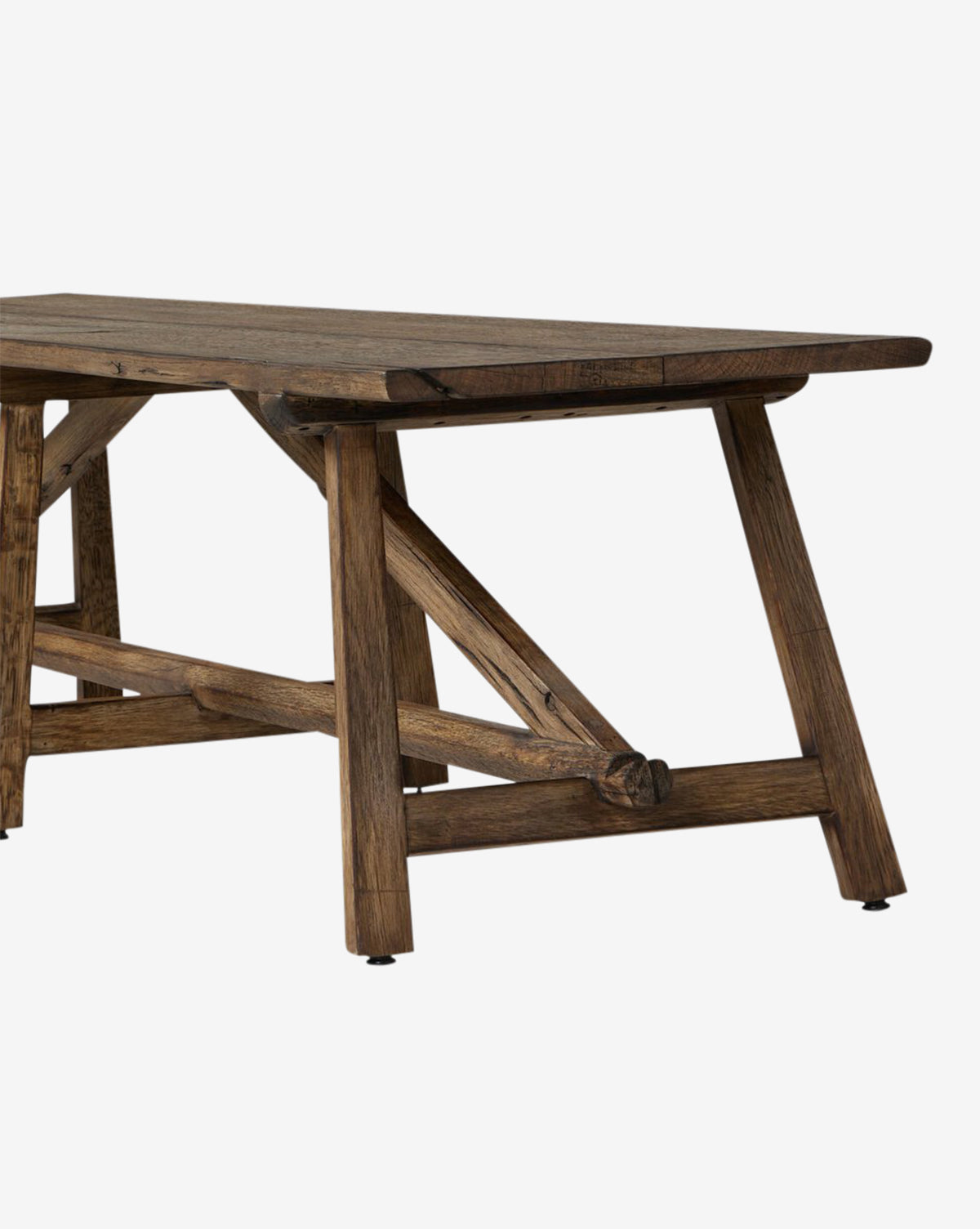 A close-up of the Inka Bench highlights its angled legs, support beams, and artisanal craftsmanship. The natural wood grain and sturdy build stand out against a plain white background, by McGee & Co.