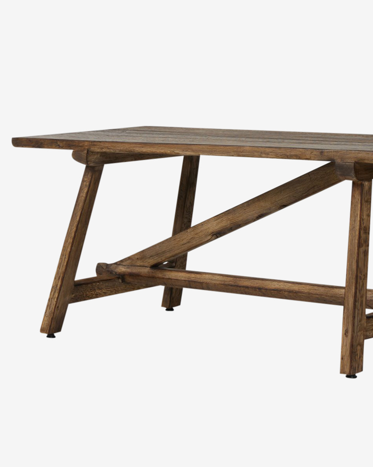 The Inka Bench features a rectangular wooden top and angled legs with cross-bracing for support. Its burnt bleached oak finish highlights rustic charm and artisanal craftsmanship by McGee & Co.