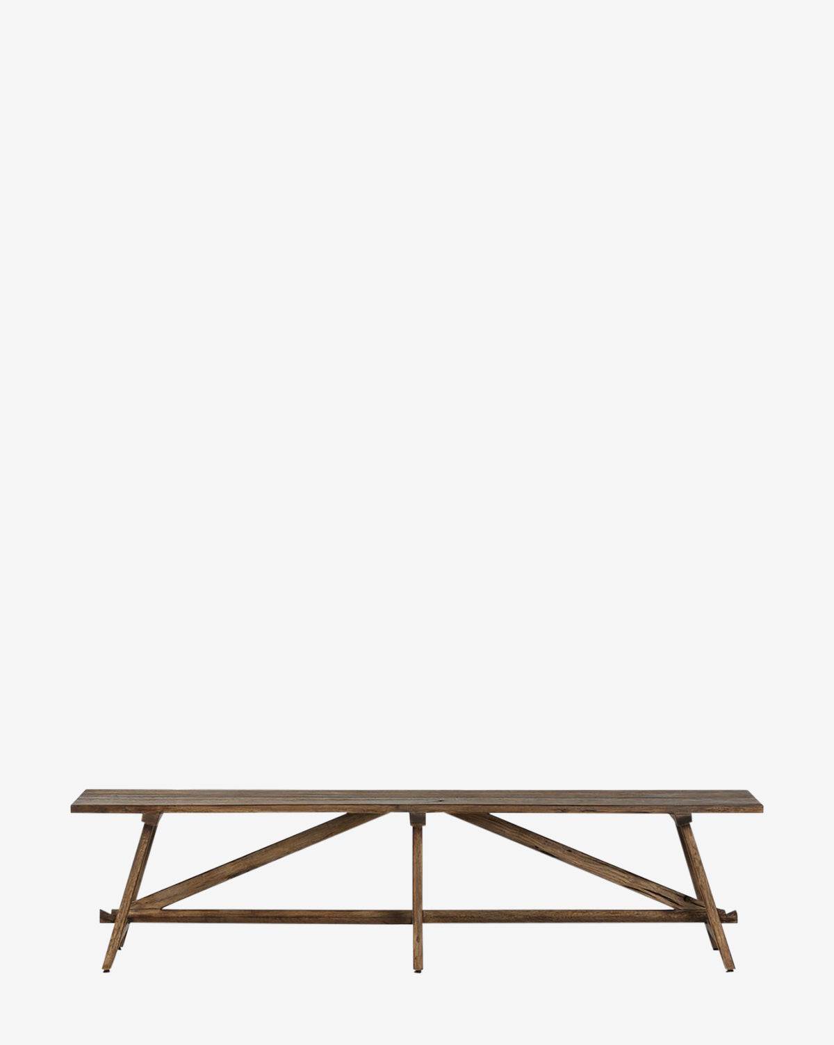 The Inka Bench, crafted from burnt bleached oak with angled legs and diagonal supports, highlights artisanal craftsmanship and stands out against a plain white background by McGee & Co.