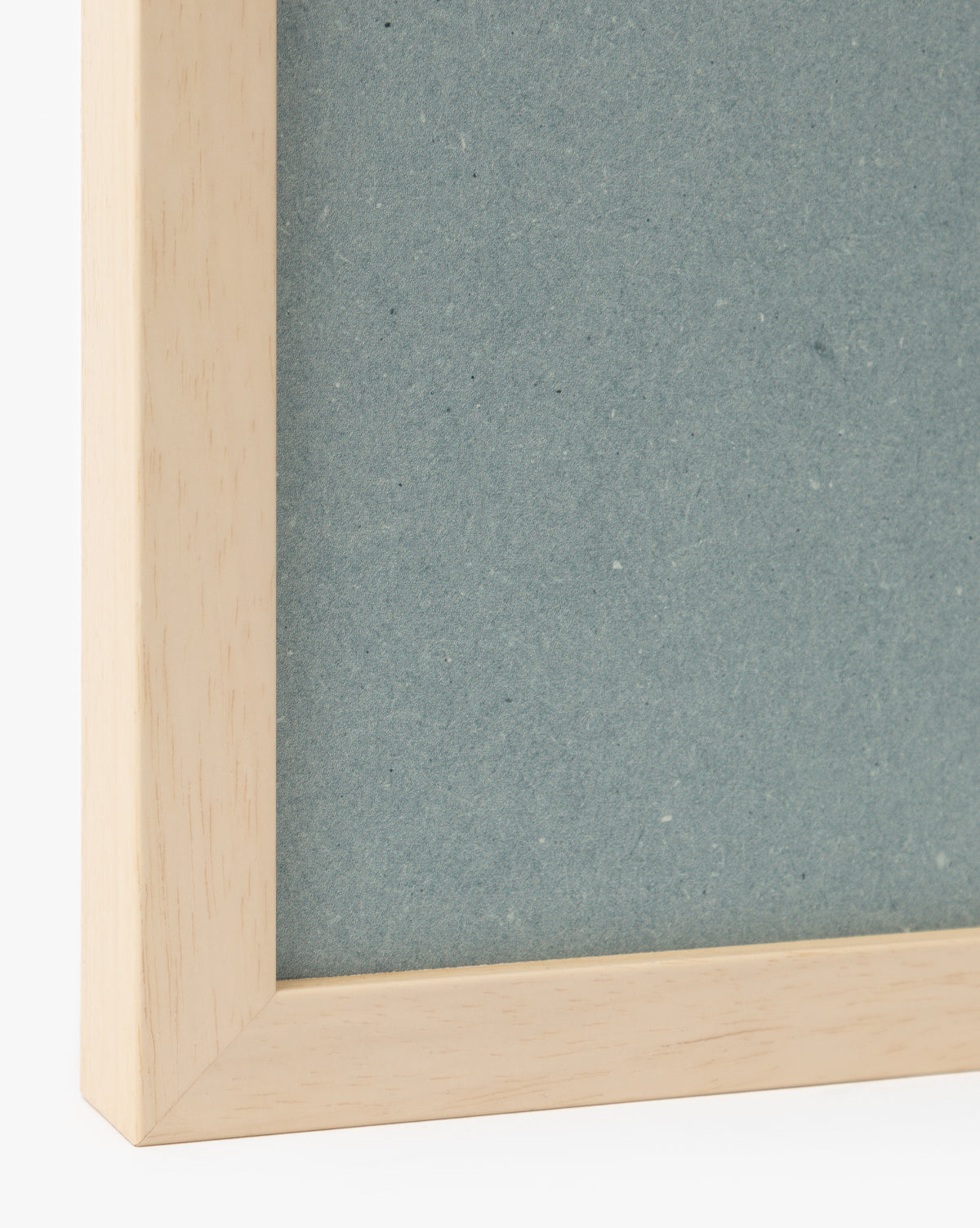 A close-up of the Iris Ink Block picture frame shows its light wood border and textured blue backing, highlighting clean lines and minimalist design—ideal for displaying iris-themed wall art in childrens room decor, by McGee & Co.