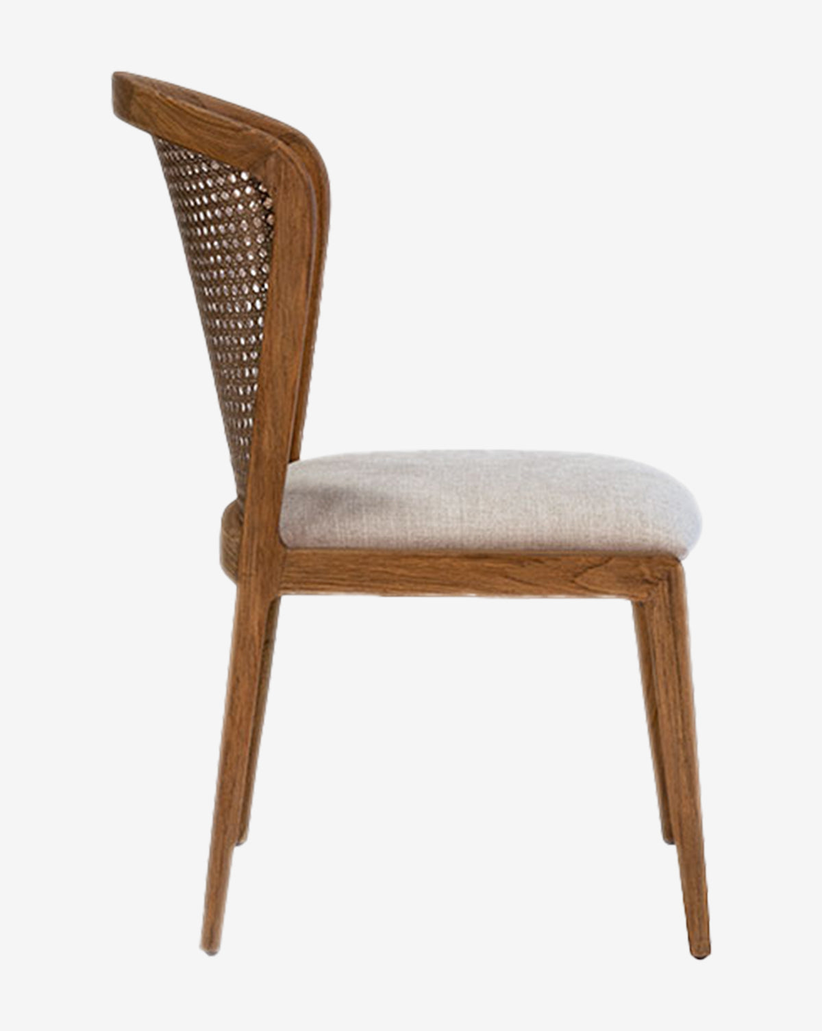 The Irma Dining Chair features a teak frame, cane back, and light upholstered seat, shown in profile view against a white background by McGee & Co.