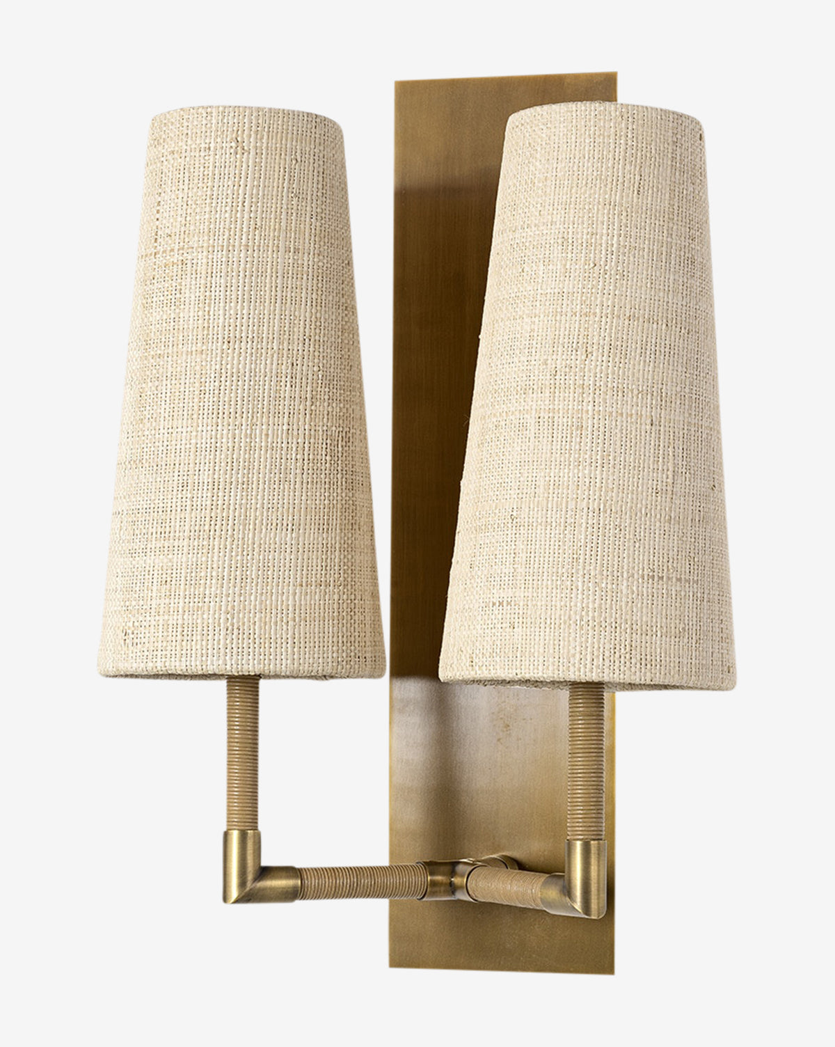 The Irving Sconce combines two cream raffia shades and leather-wrapped arms on a brass backplate, achieving a modern design, by McGee & Co.