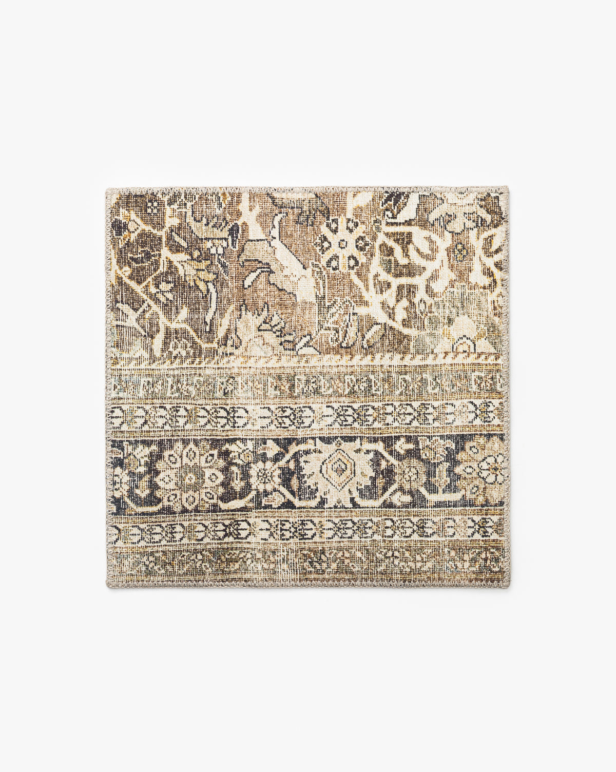An Isameta Rug Swatch with a vintage-inspired floral and geometric pattern in beige, brown, and gray is shown on a plain white background by McGee & Co.
