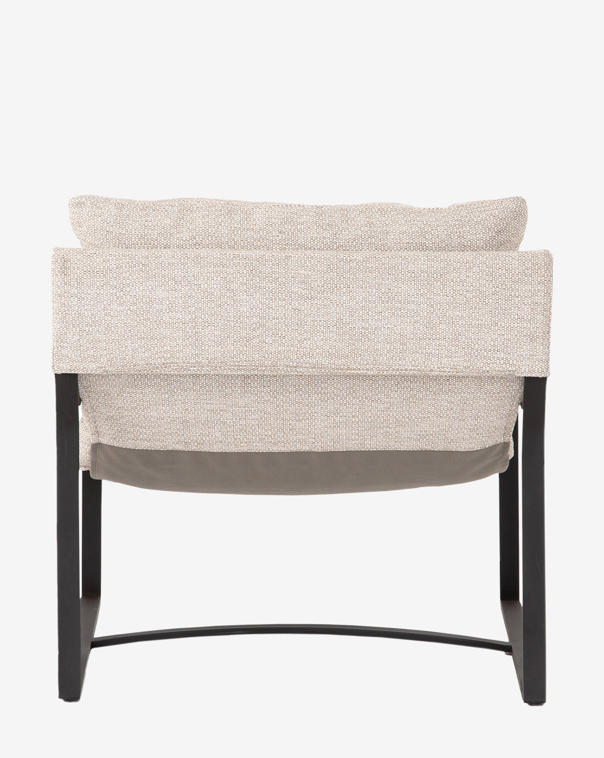 The Ismay Sling Chair is a modern iron chair with a black metal frame, curved legs, light beige upholstery, and a removable cushion. Shown from the back against a plain white background by McGee & Co.