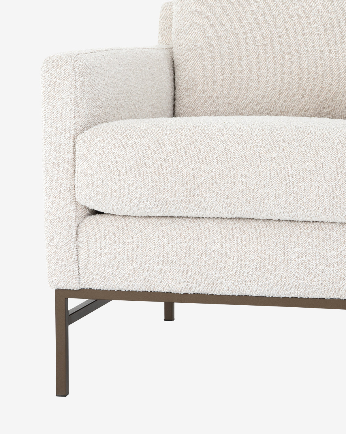 Close-up of the Ivan Lounge Chair, featuring textured off-white upholstery, a cushioned backrest, square arms, and slim dark metal legs for a modern look, by McGee & Co.