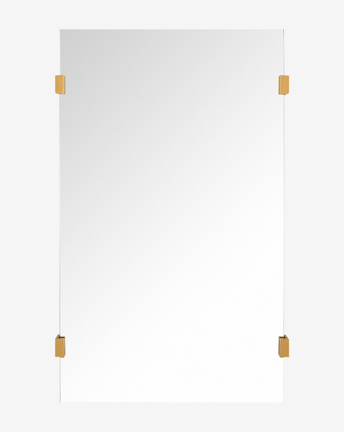 The Ivana Mirror showcases a modern, rectangular frameless design with burnished brass corner brackets, set against a simple background by McGee & Co.