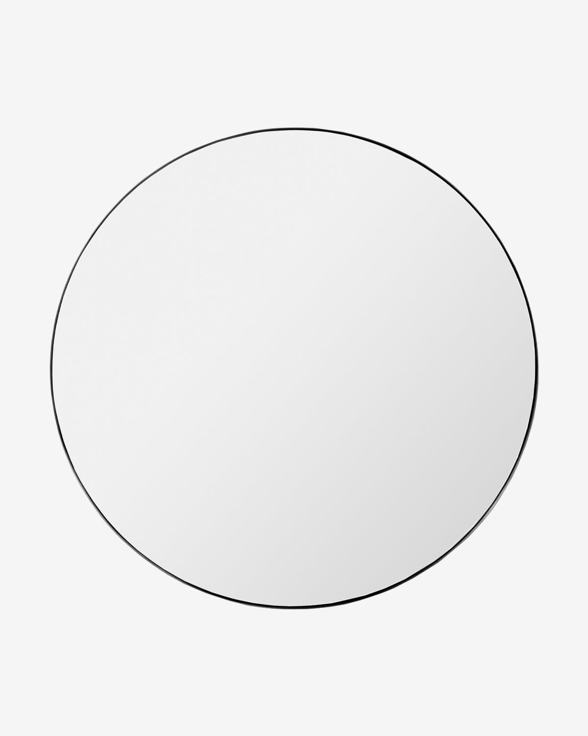 The Jace Inset Circle Mirror features a round, frameless design with shatterproof glass and a slim black border, shown against a plain white background by McGee & Co.