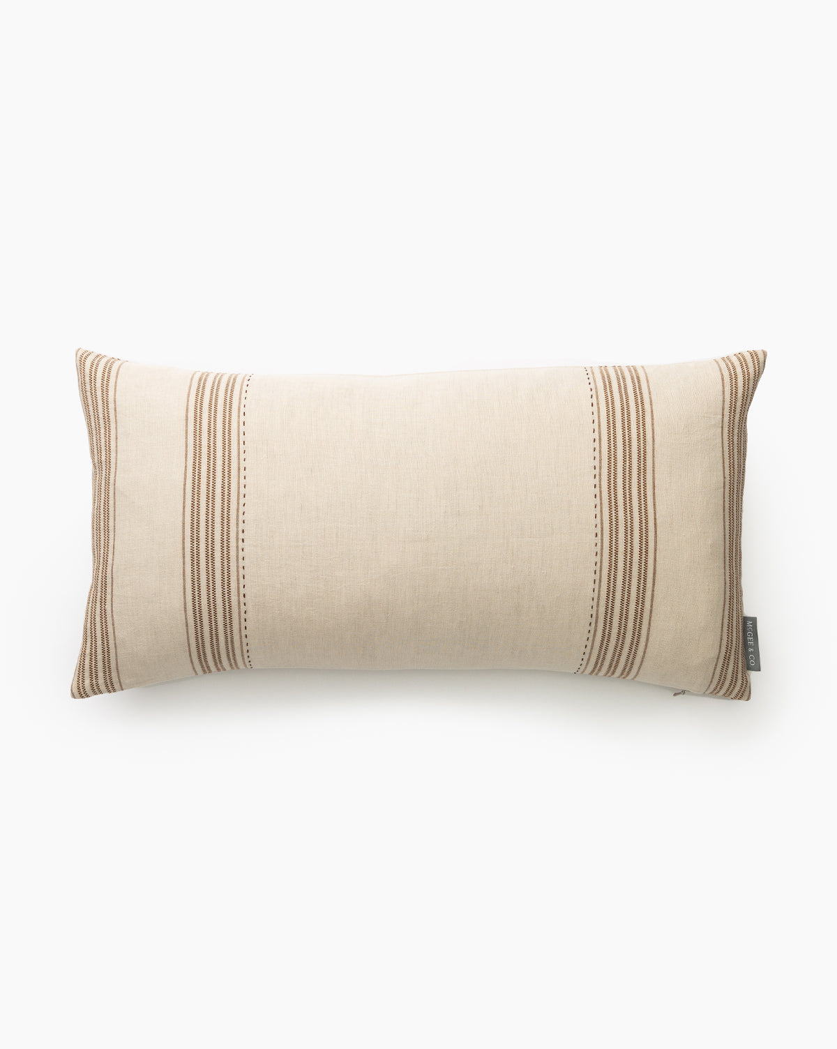 The Jennings Pillow Cover is a rectangular beige linen-cotton cover with brown vertical stripes on each side and a small fabric tag on the right edge, displayed against a plain white background by McGee & Co.