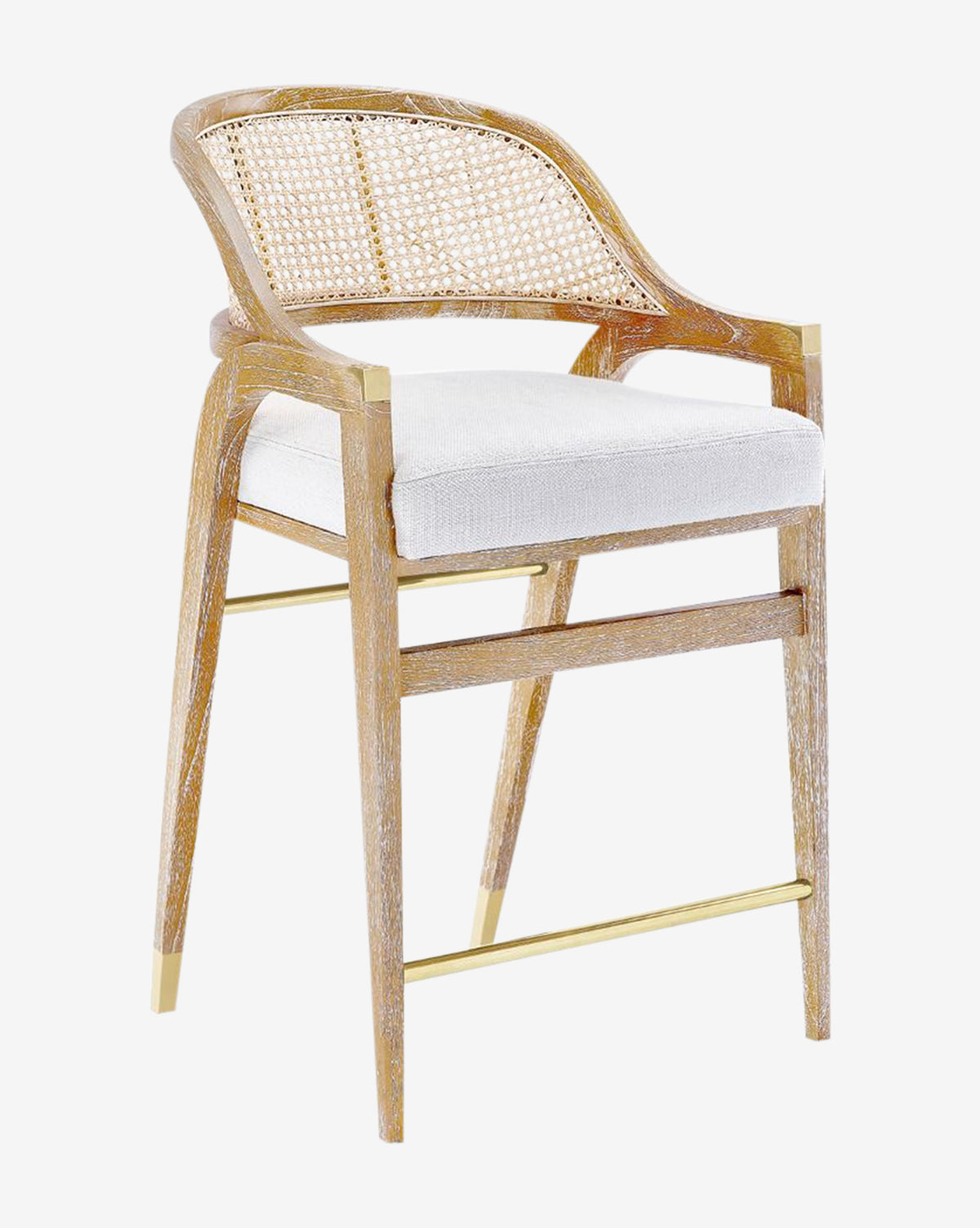 The Jensen Counter Stool has a solid Cape Lilac Mahogany frame, hand-woven cane back, white cushion seat, angled legs, and gold accents on the footrest and leg tips, by McGee & Co.