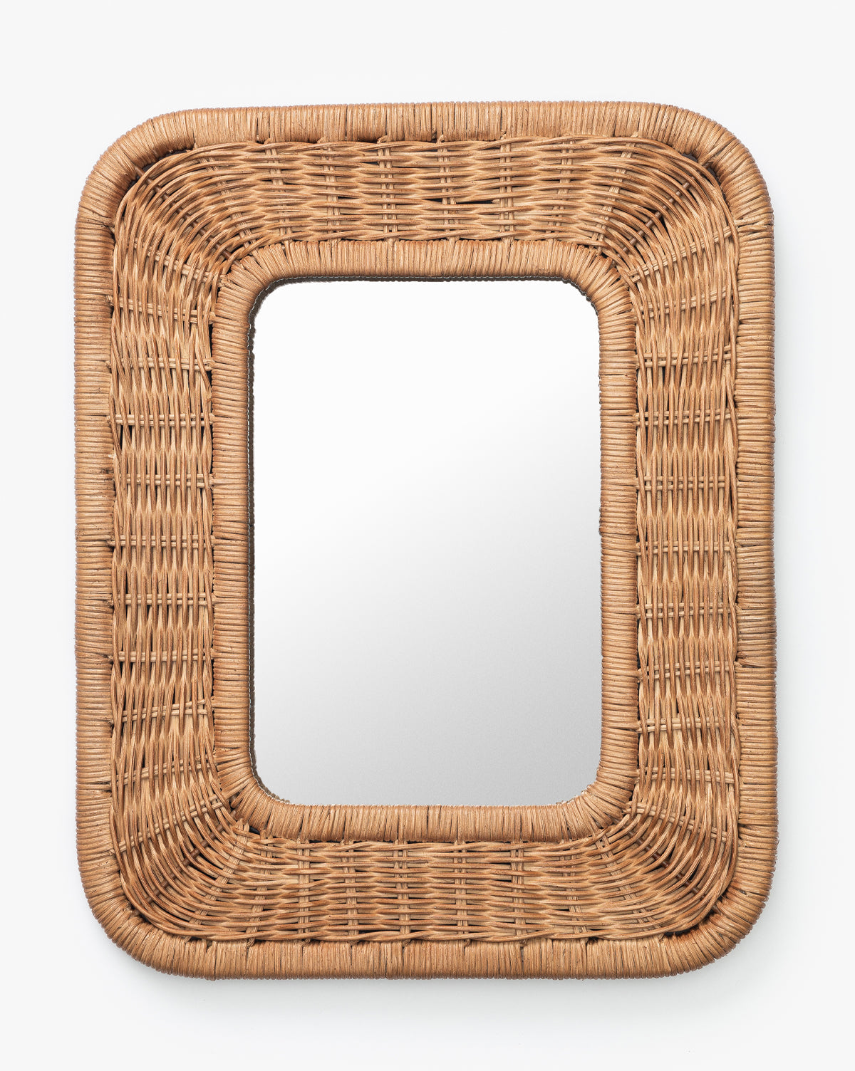 The Jera Shelf Mirror features a rectangular woven rattan frame with rounded corners in natural brown, displayed against a plain white background by McGee & Co.