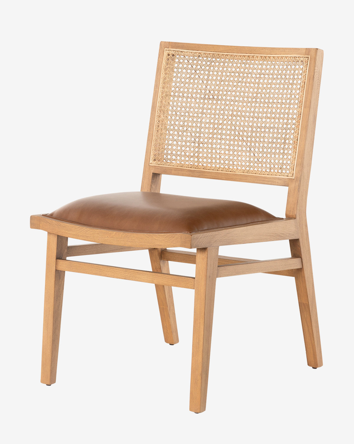 The Jett Dining Chair boasts a minimalist design with clean lines, crafted from beech wood and featuring a woven cane backrest plus a comfortable brown leather seat, by McGee & Co.