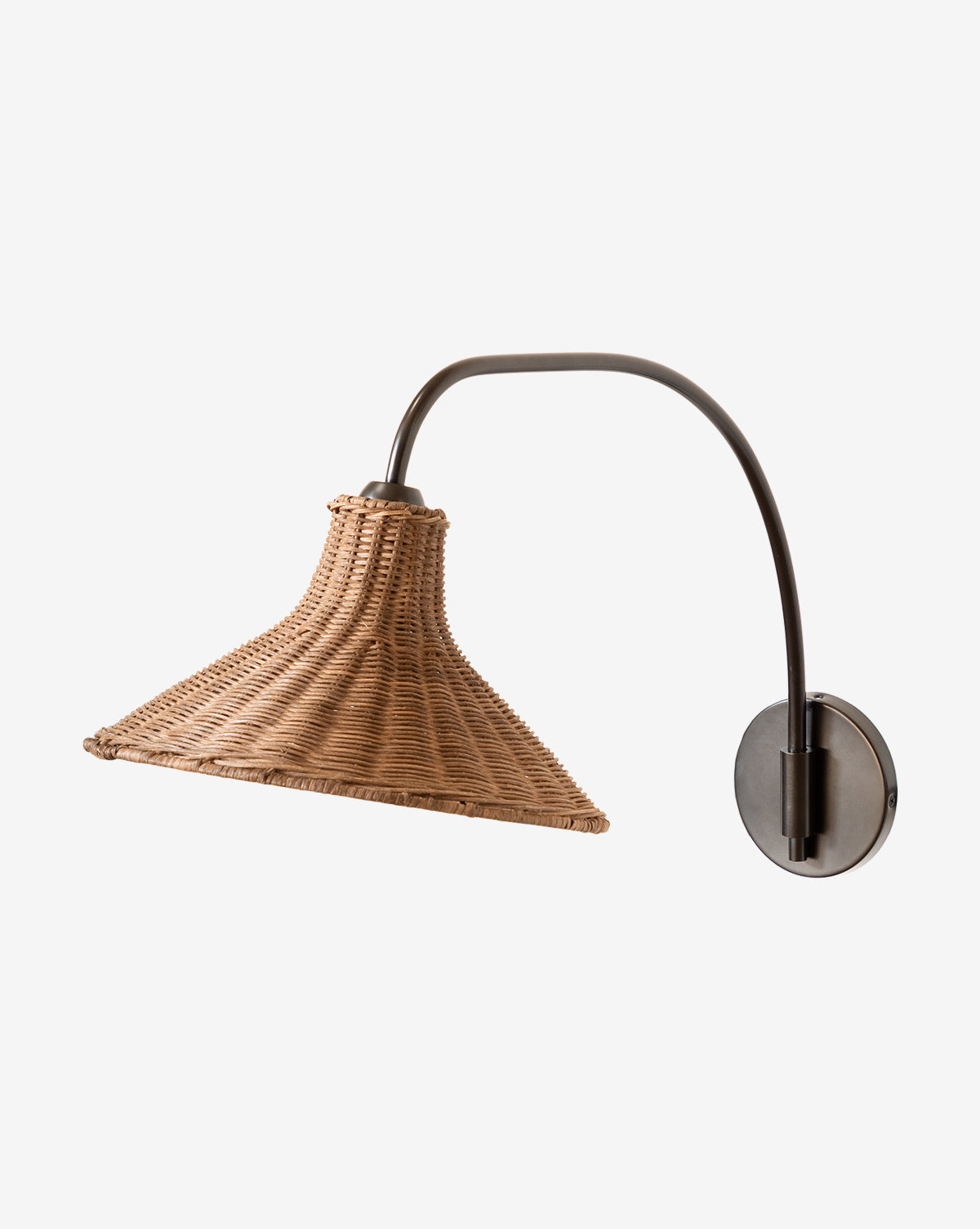 The Makerspalm Johanson Woven Sconce features a natural rattan conical shade and a curved antique bronze arm on a round wall plate, shown against a plain white background. McGee & Co.