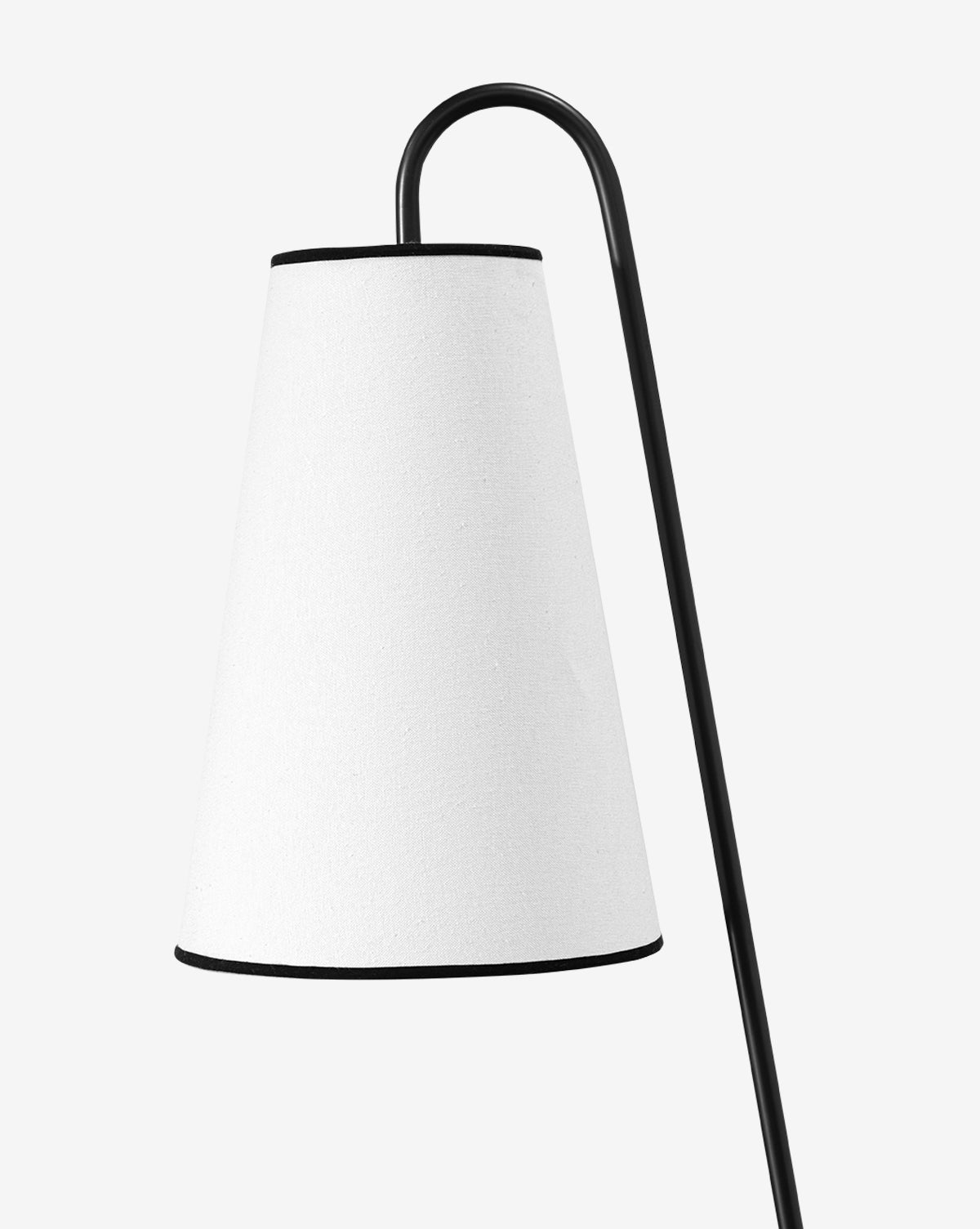 The Jonas Floor Lamp boasts a sleek black curved metal stand and a white linen shade, offering a modern design perfect for contemporary spaces, by McGee & Co.