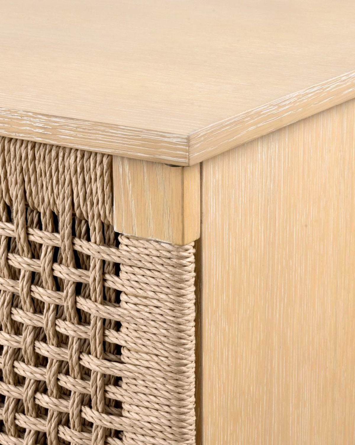 Close-up of the Jovan Cabinet corner showing a woven rope front panel, highlighting natural textures and a smooth matte oak wood finish, by McGee & Co.