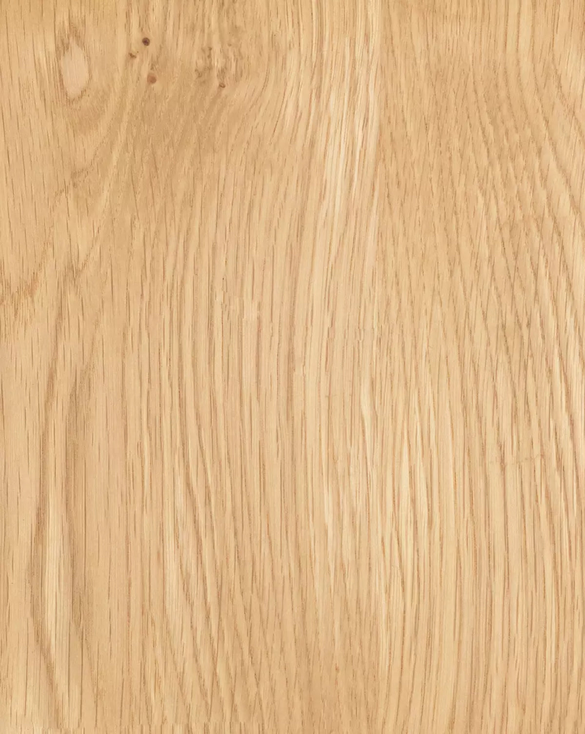 Close-up of the Juliana Extension Dining Table’s light brown solid oak surface, highlighting its modern design with visible natural grain patterns and subtle knots, by McGee & Co.