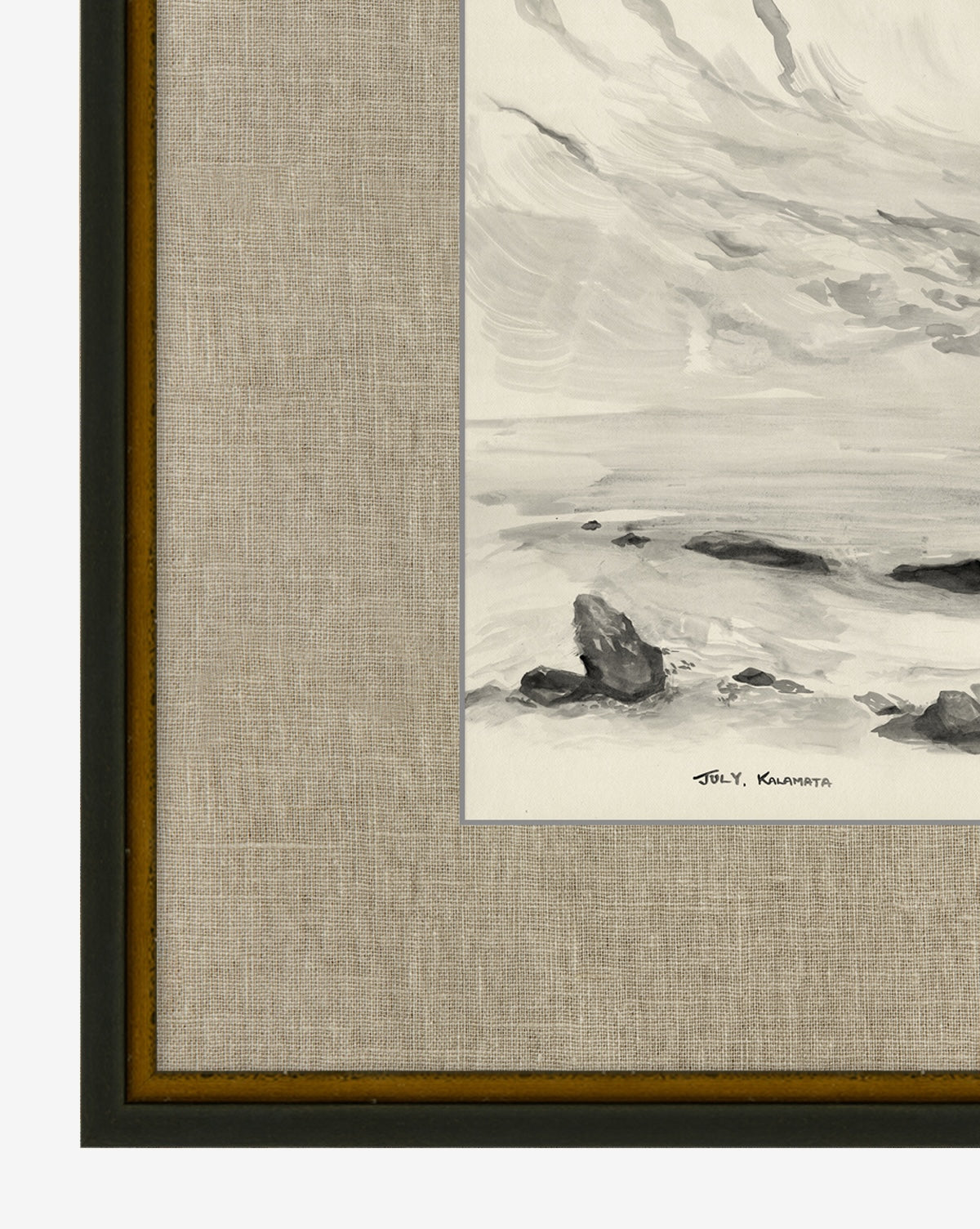 A close-up of the framed “July in Kalamata” painting shows waves crashing on rocks in black, white, and gray tones, set in a distressed black frame with a hand-wrapped linen mat and signed by artist Jol Y. Kuwahara.
