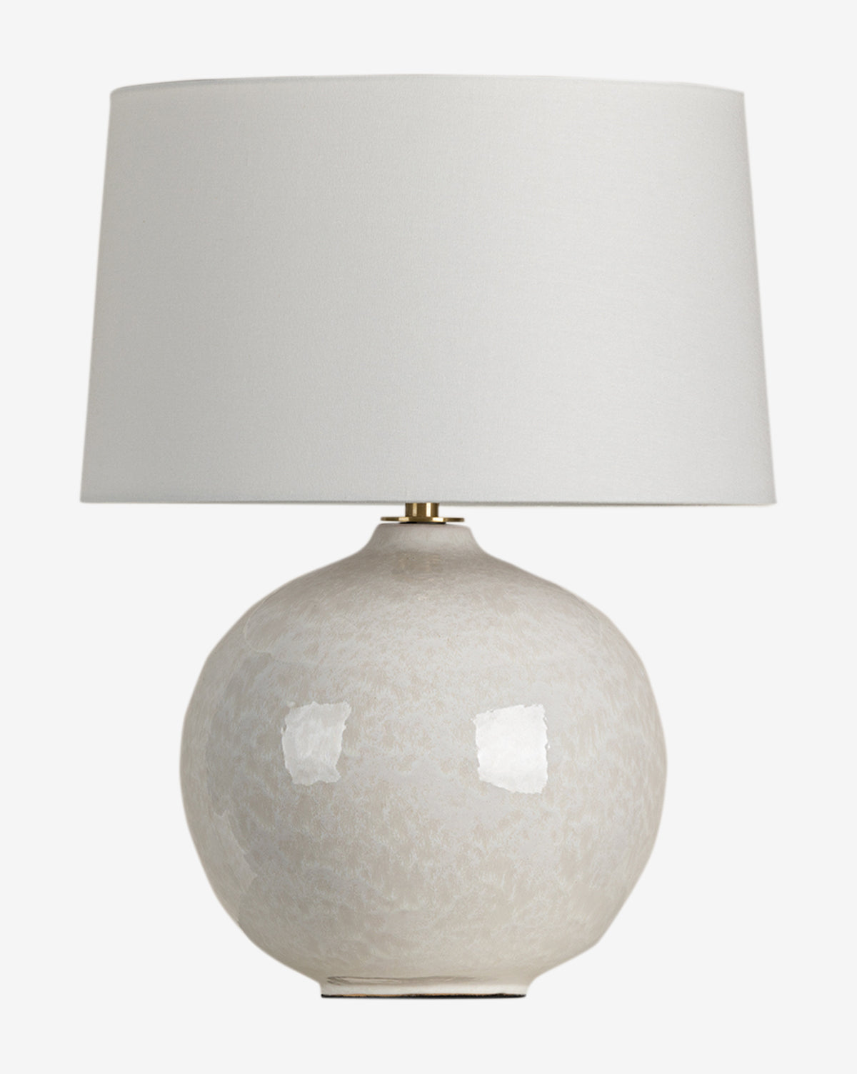 The Karina Table Lamp has a round light beige ceramic base with an ivory finish, subtle texture, and a wide off-white fabric shade, by McGee & Co.