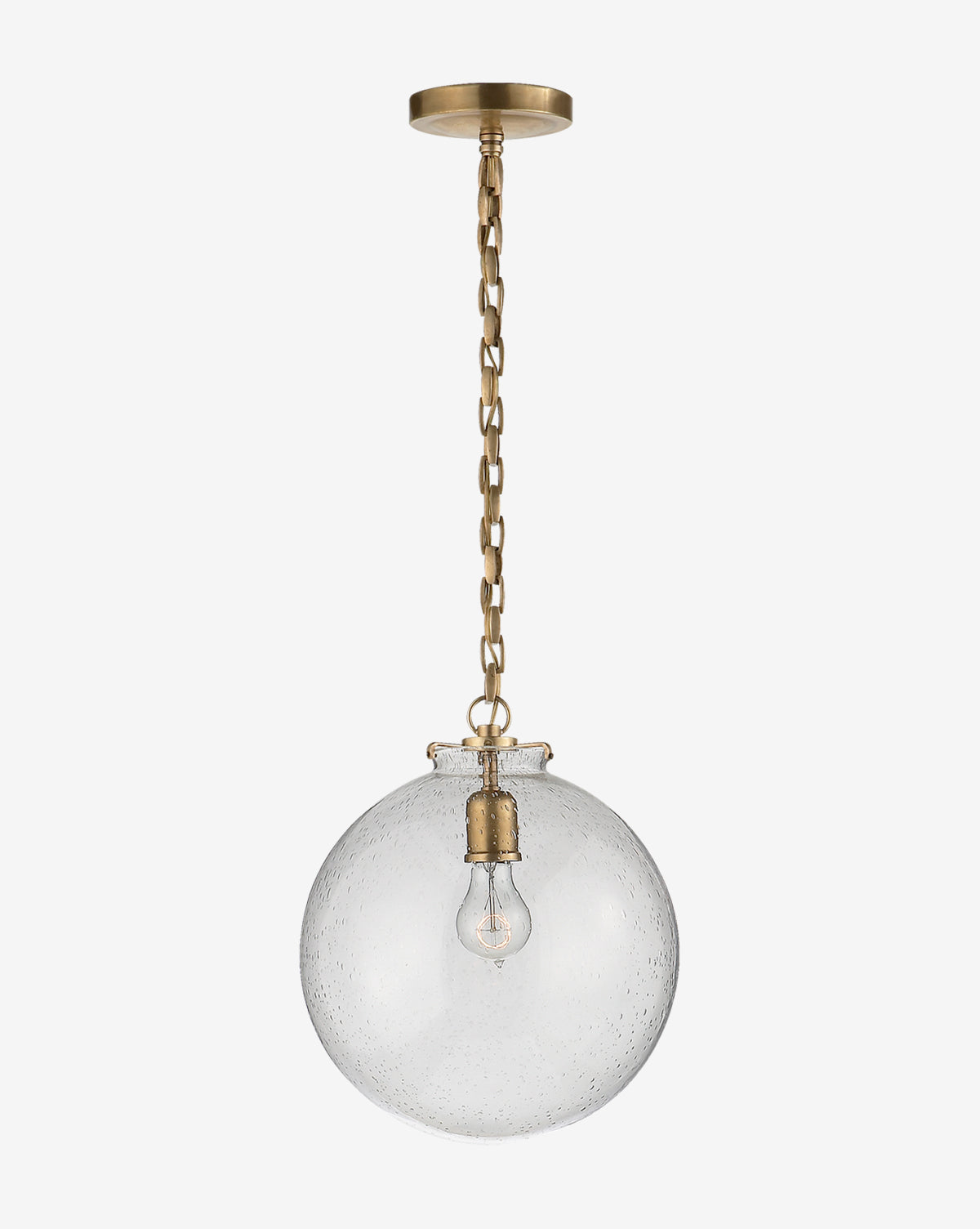 The Katie Globe Pendant by Visual Comfort & Co. Signature features a brass chain, round glass globe shade, and exposed bulb for a timeless look. McGee & Co.