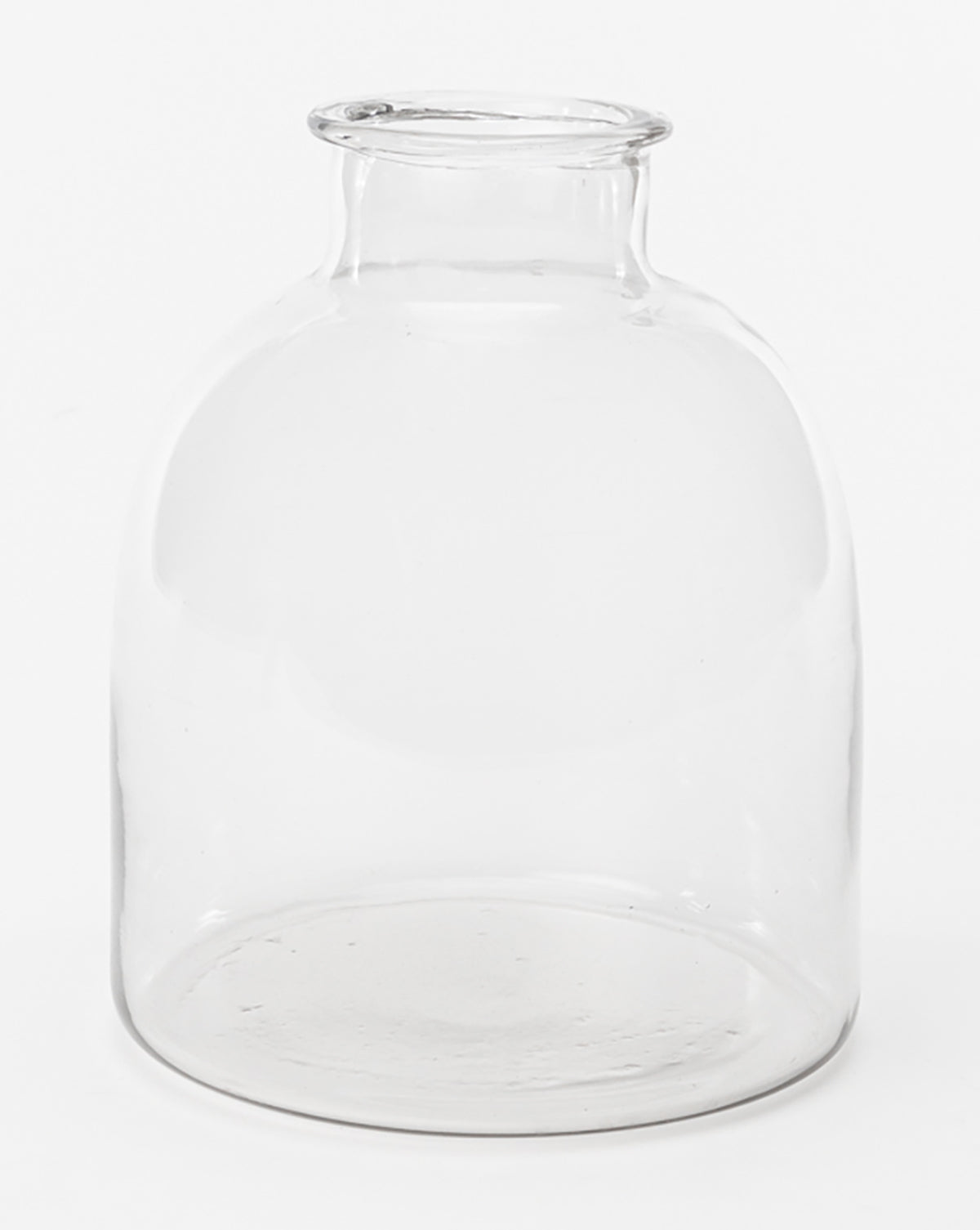 The Kelby Glass Vase features a clear, cylindrical design with a short neck and wide opening, set against a plain white background—ideal for modern minimalist decor.