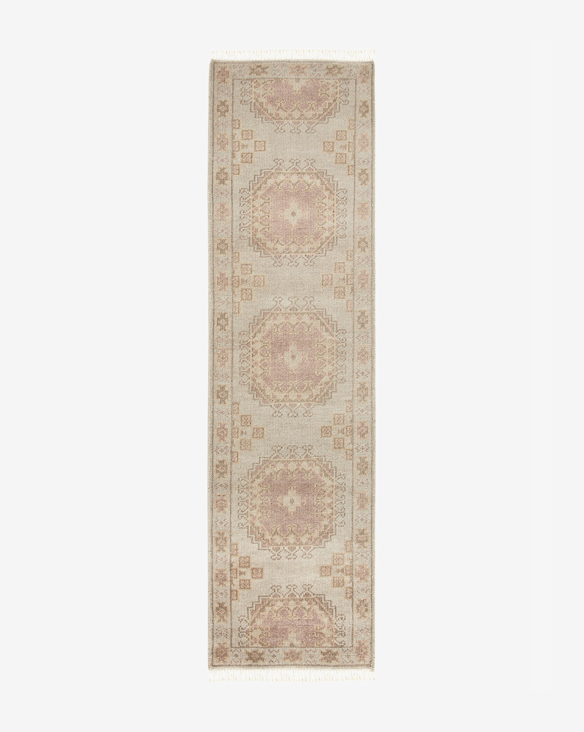 The Kenna Hand-Knotted Wool Rug features a rectangular, vintage design in muted beige, pink, and tan tones with four central medallions and ornate borders, all displayed against a white background, by McGee & Co.