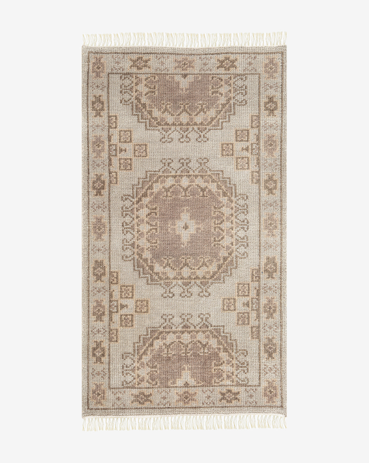 The Kenna Hand-Knotted Wool Rug features a rectangular shape, traditional geometric and floral patterns in beige and taupe, hand-knotted craftsmanship, and fringed edges on the shorter sides, by McGee & Co.