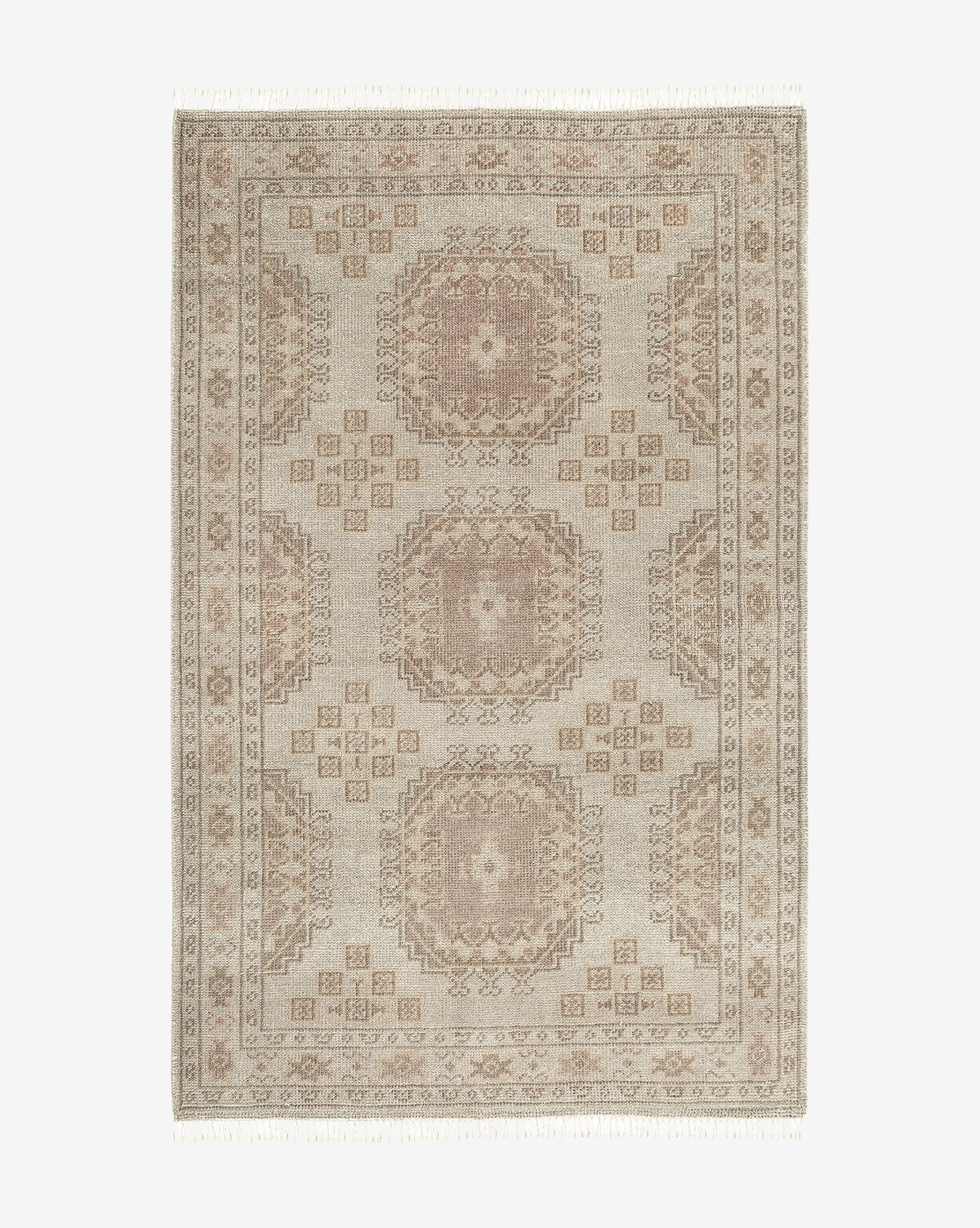 The Kenna Hand-Knotted Wool Rug features a traditional rectangular design with geometric medallions, intricate borders, and fringes in beige and light brown, adding timeless elegance to any space, by McGee & Co.