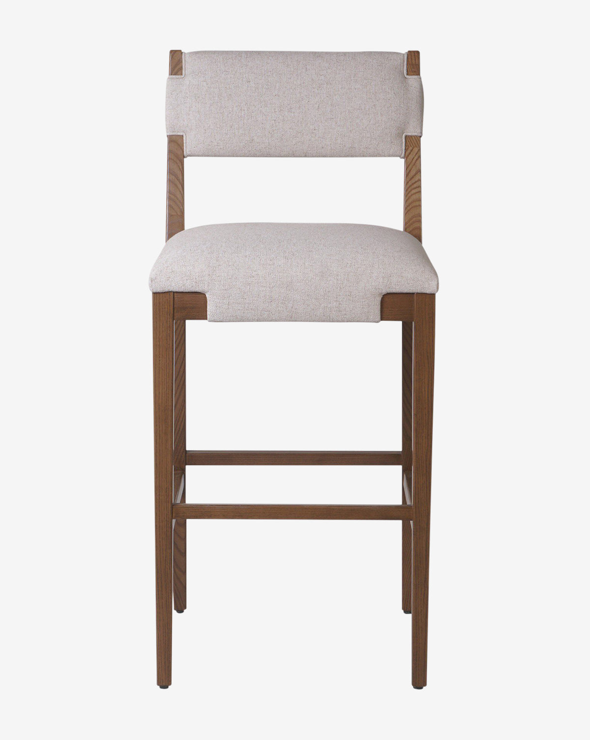 The Kennebec Stool by Four Hands features a wooden ash frame, light beige performance fabric upholstery on the seat and backrest, and straight legs. Shown from the front against a white background, it offers a simple, modern design by McGee & Co.
