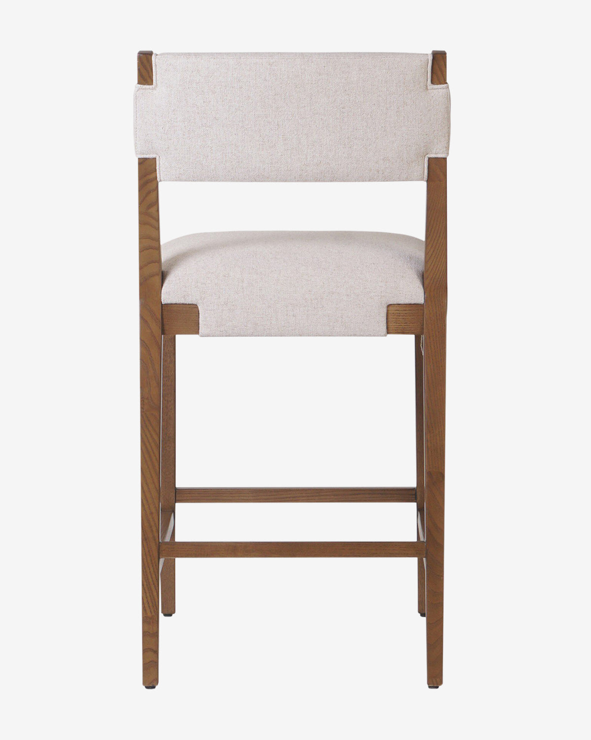 The Kennebec Stool by Four Hands features a modern ash frame with wooden legs in a natural finish and a light beige performance fabric seat and backrest, shown from the back against a white background, McGee & Co.