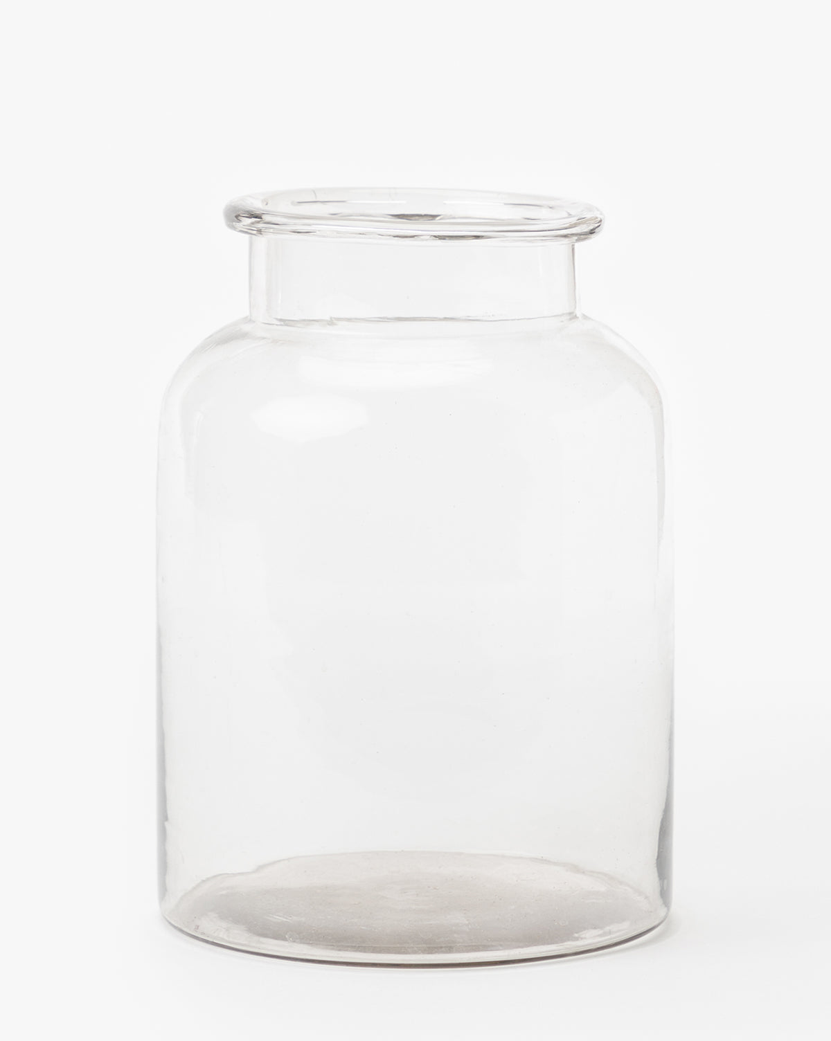 The Kern Glass Jar features a wide opening and comes without a lid, showcased against a white background—ideal for decorative displays or adding an airy style to your home.