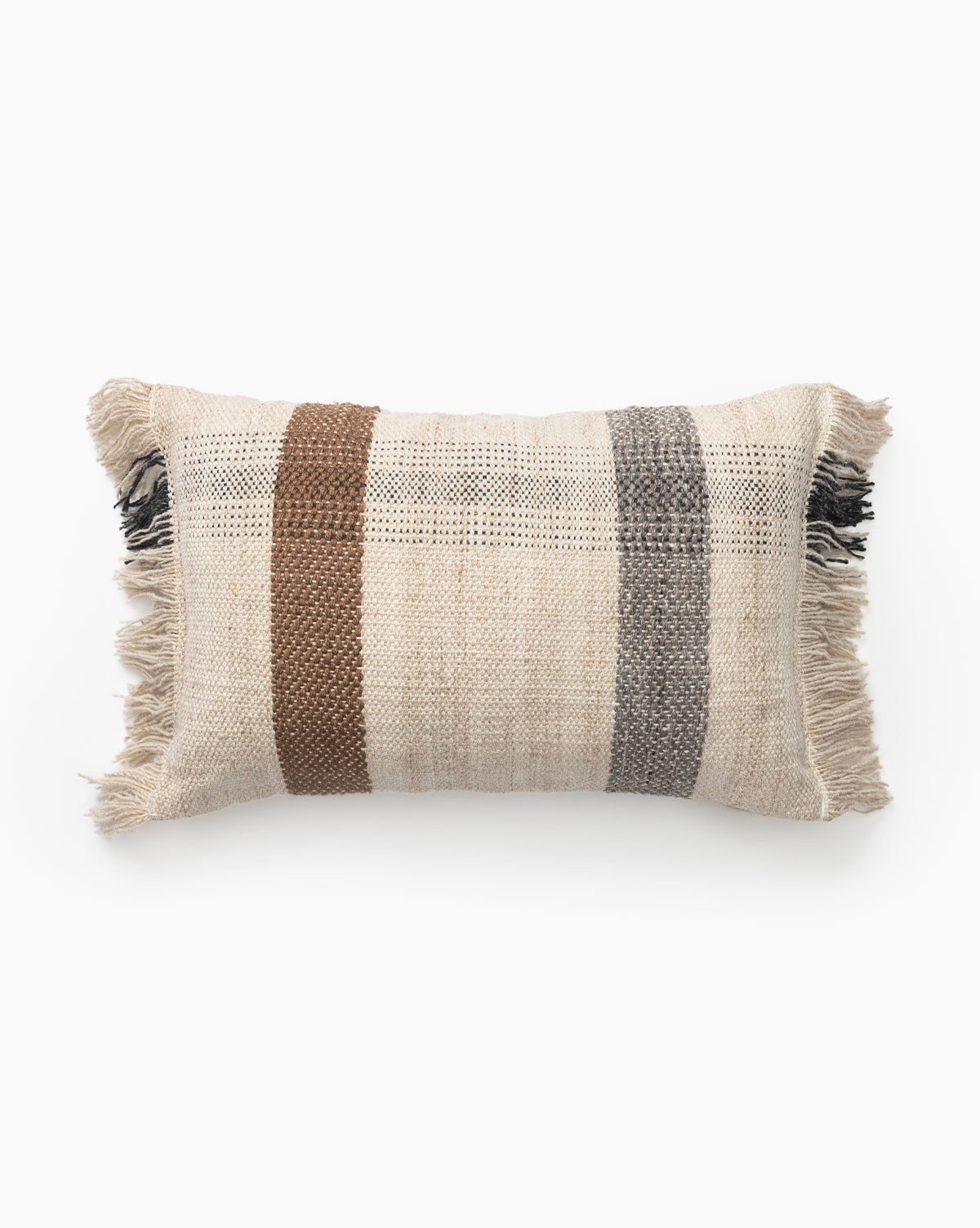 The Kinley Indoor/Outdoor Pillow features beige, brown, and gray vertical woven stripes with fringe on the short edges, making it a stylish addition to your patio décor, by McGee & Co. Shown on a white background.