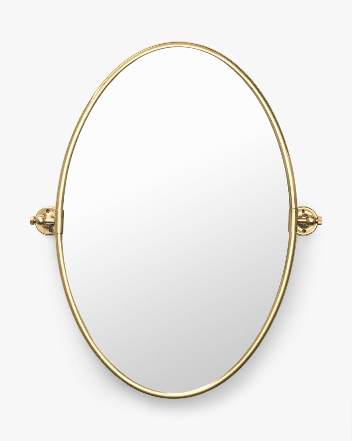 The Kitson Oval Mirror has a thin antique brass metal border and two side brackets for mounting, shown against a plain white background by McGee & Co.
