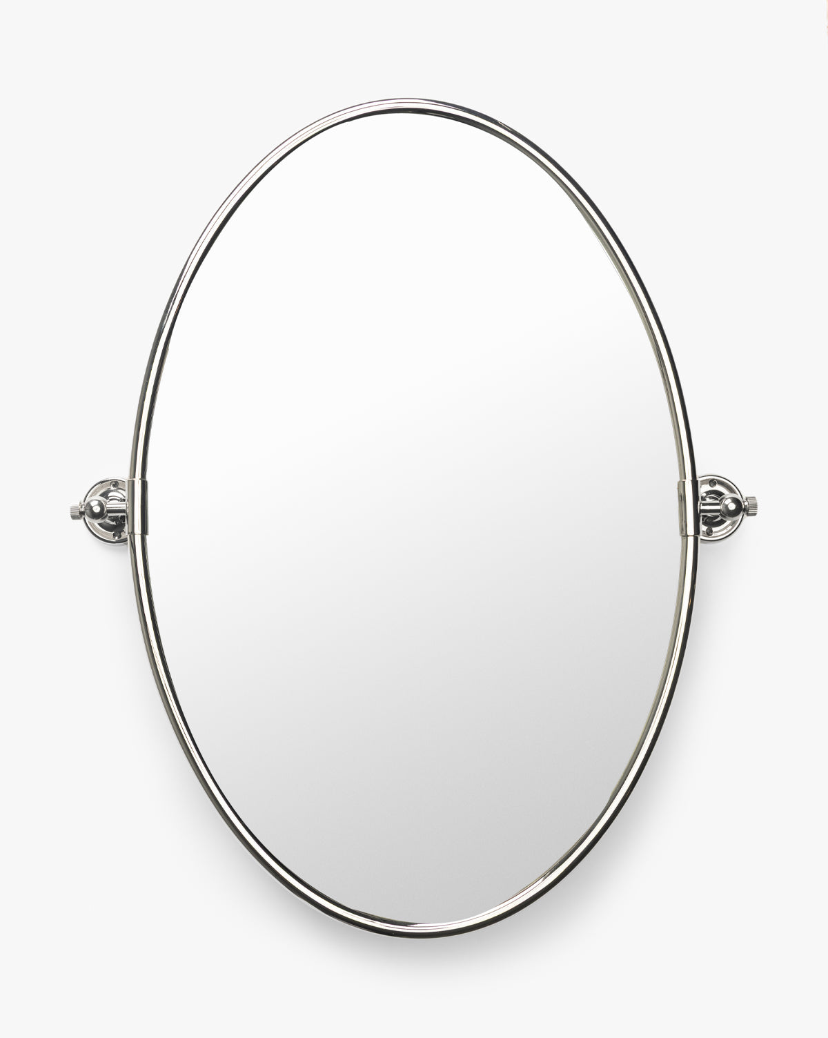 The Kitson Oval Mirror features a slim, polished antique brass frame and two adjustable side brackets. Wall-mounted, it stands out elegantly against a white background by McGee & Co.